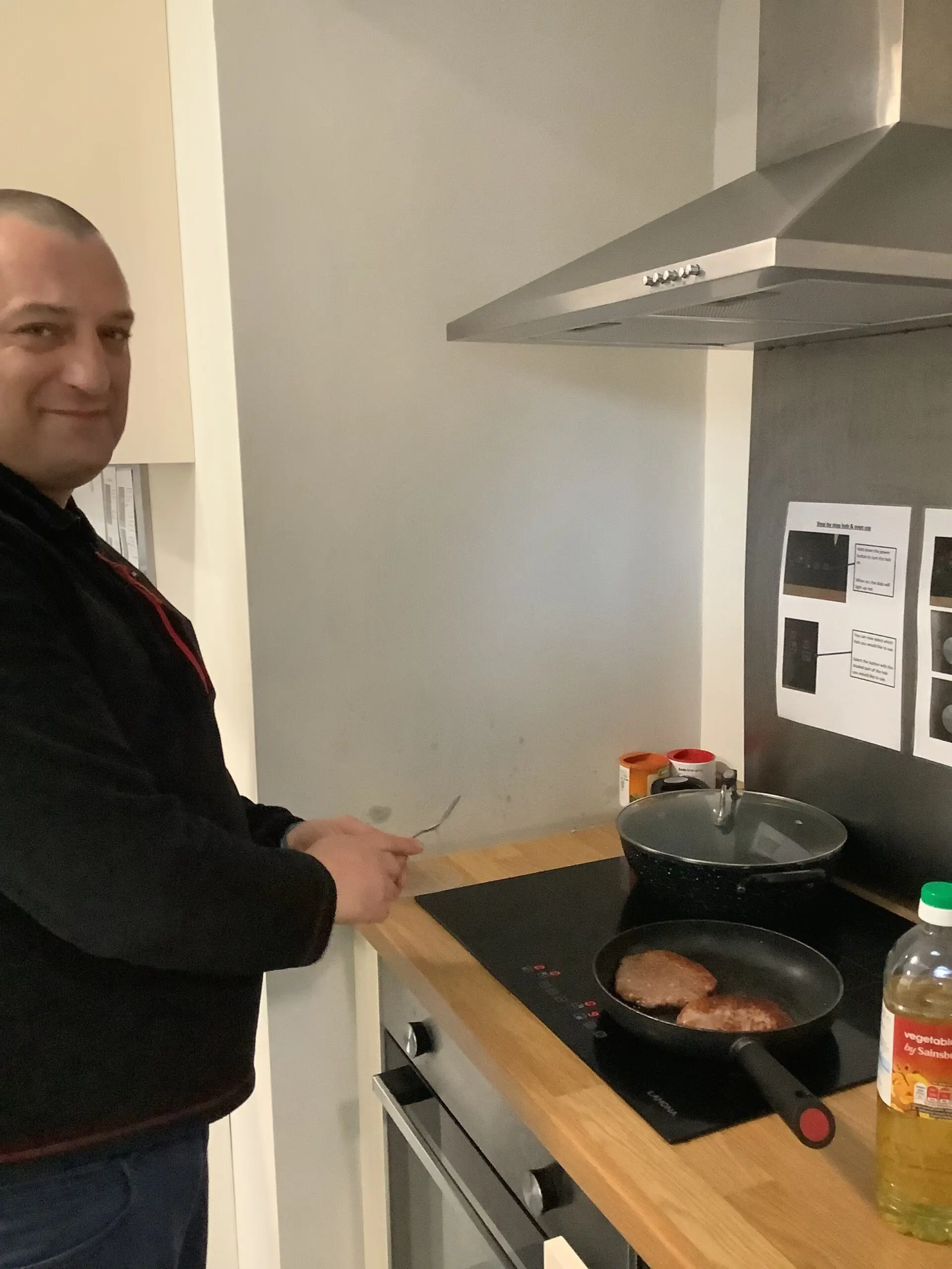 resident frying burgers
