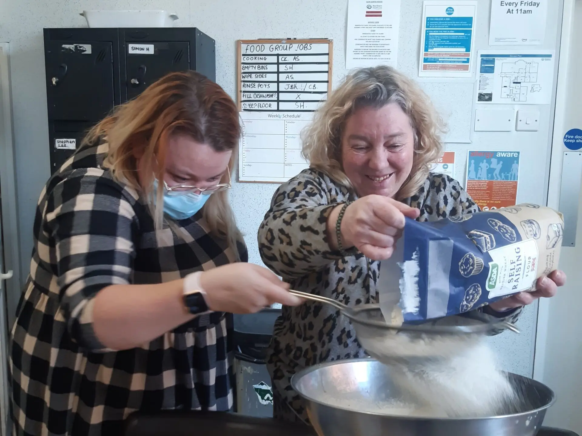 adding flour to cake mix