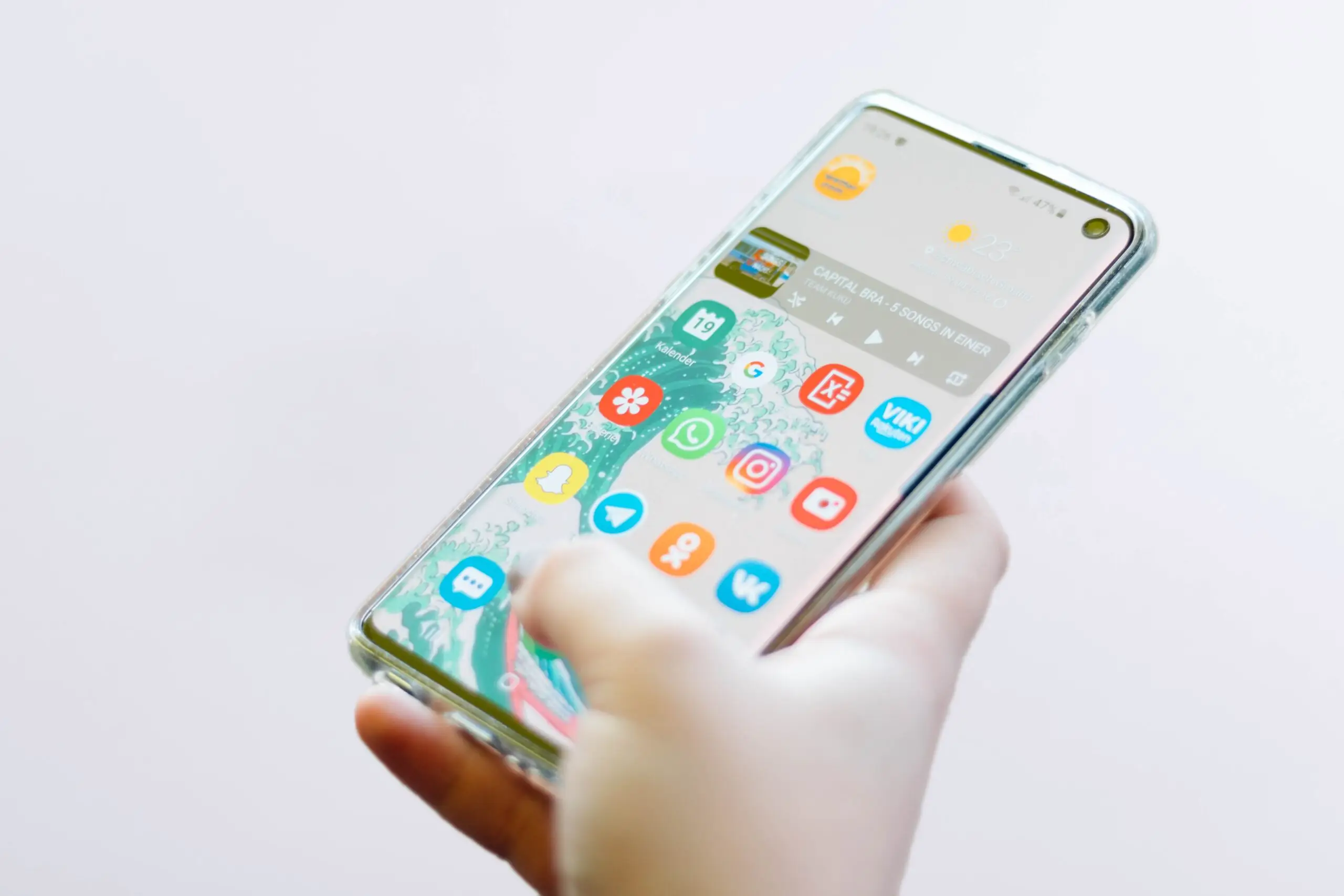 phone displaying apps in hand