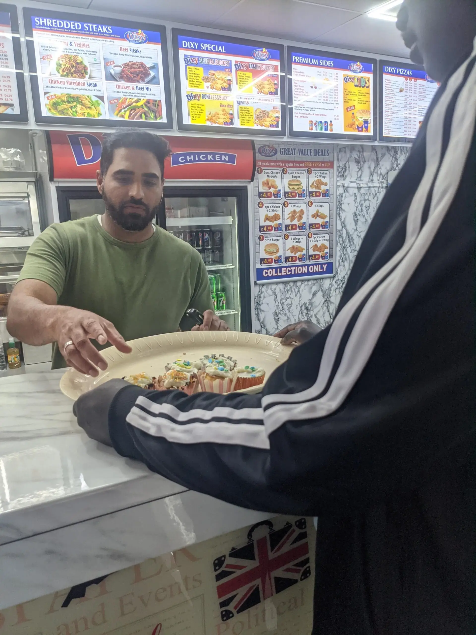 resident handing out cupcakes to local businesses