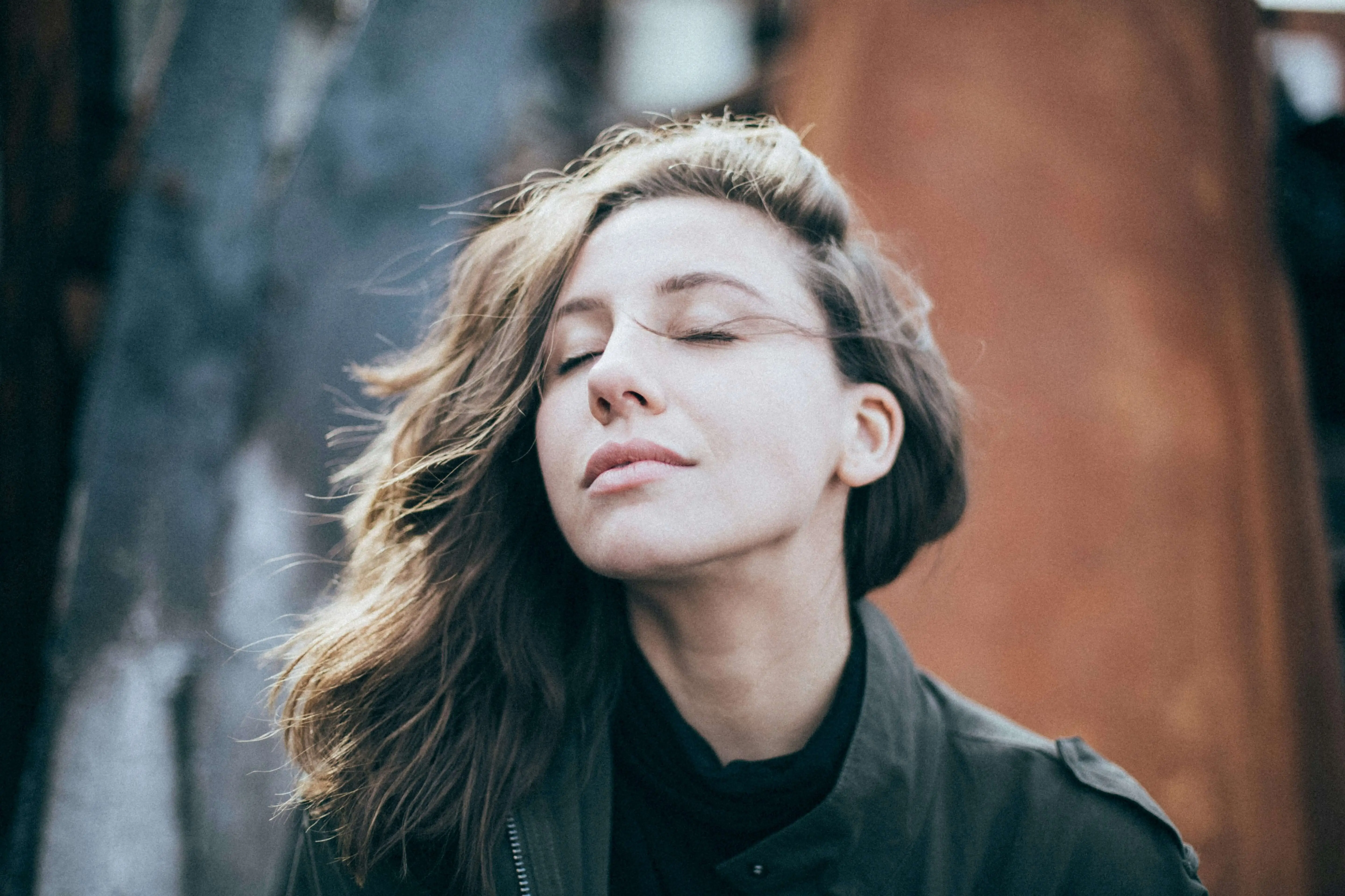 Woman taking deep breaths to help regulate her central nervous system (CNS).