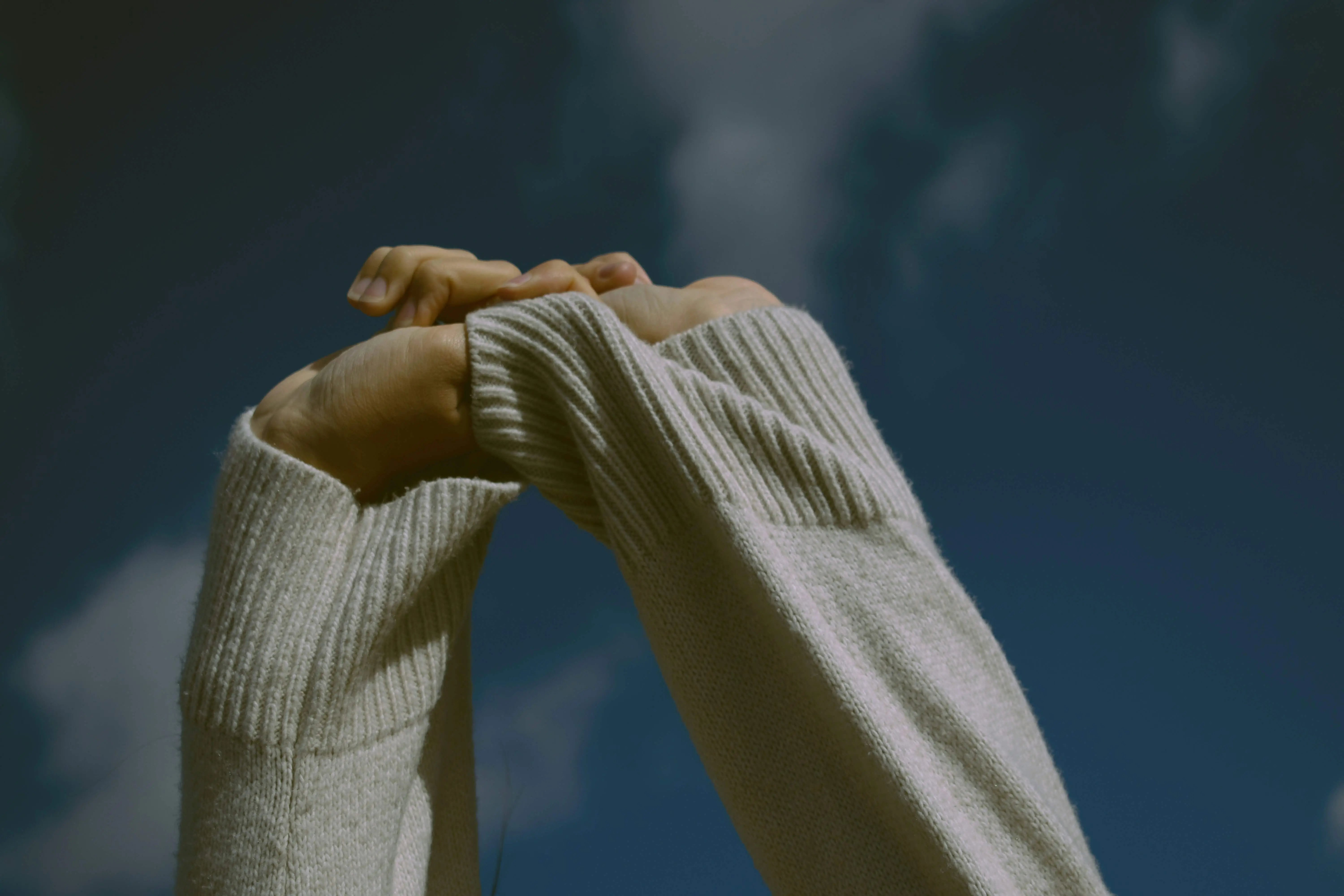 Woman's hands in the sky representing the story of Michaela in Northern Healthcare supported living.