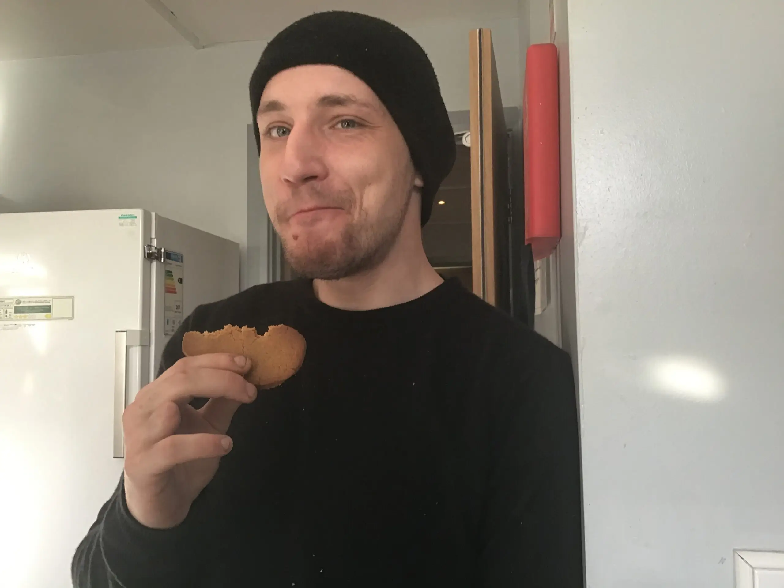 resident eating gingerbread biscuit