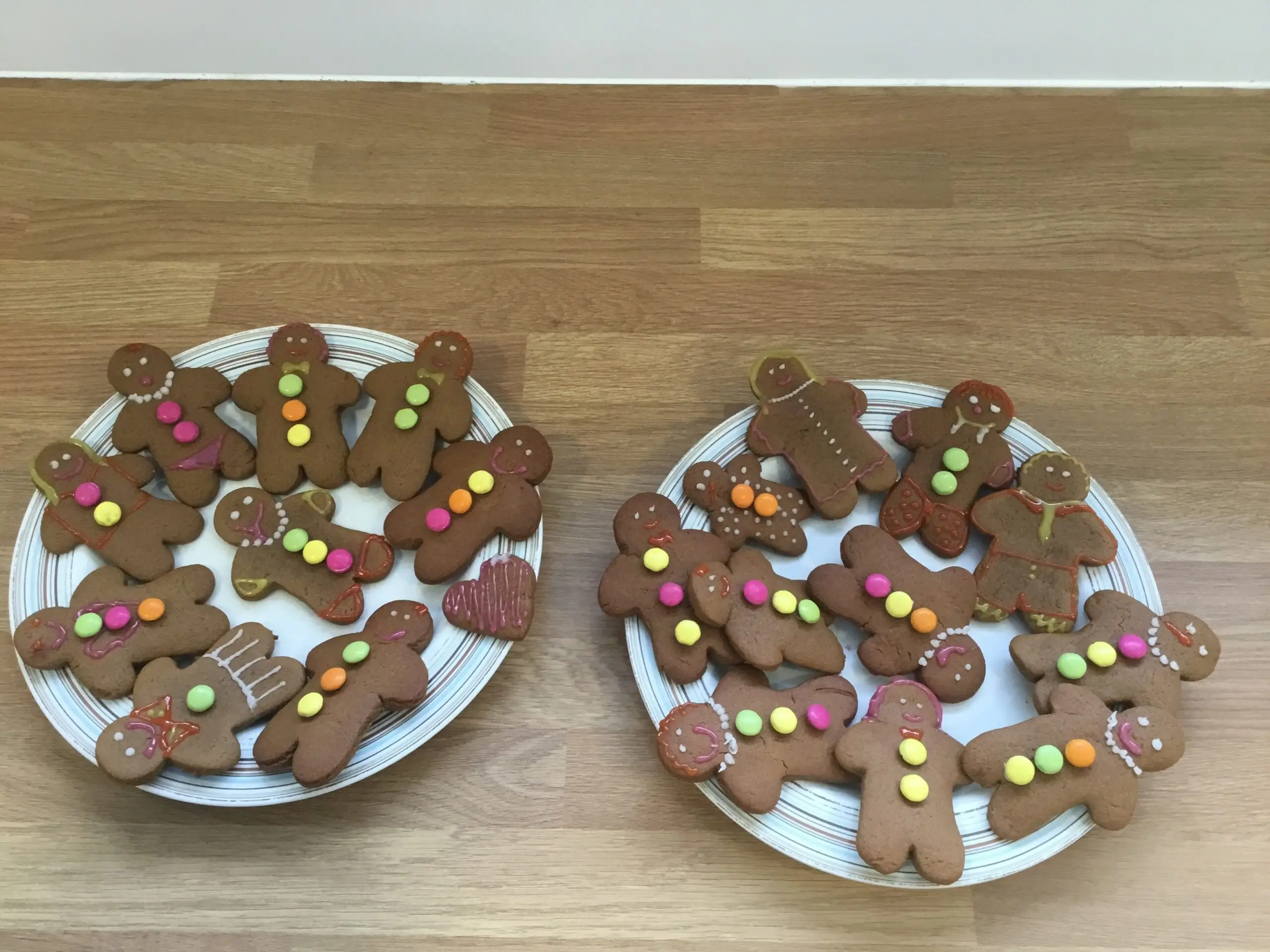 2 plates of homemade vegan gingerbread biscuits