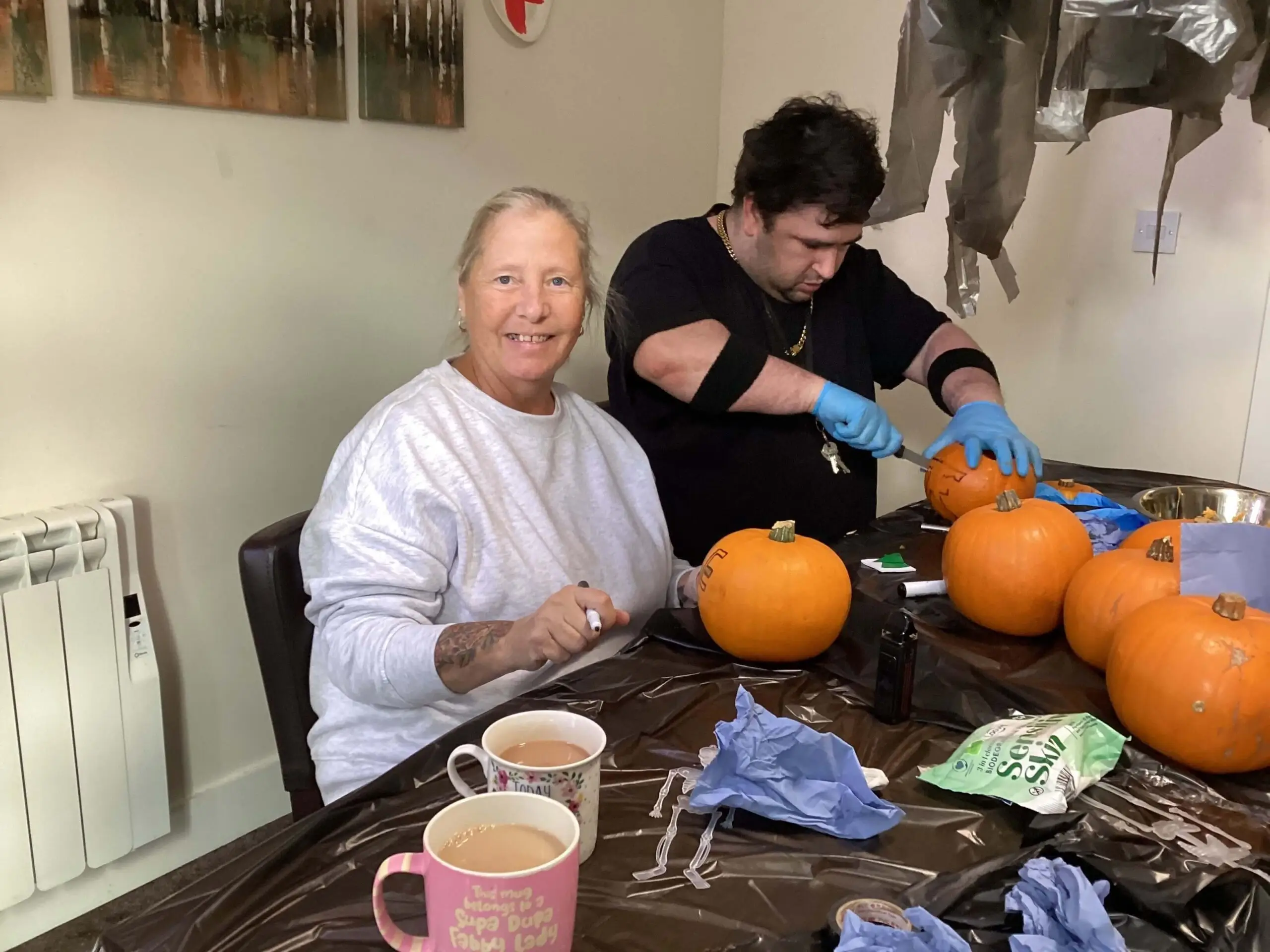 Residents carving pumpkins