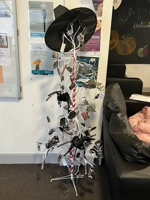 coat rack used for Halloween decorations
