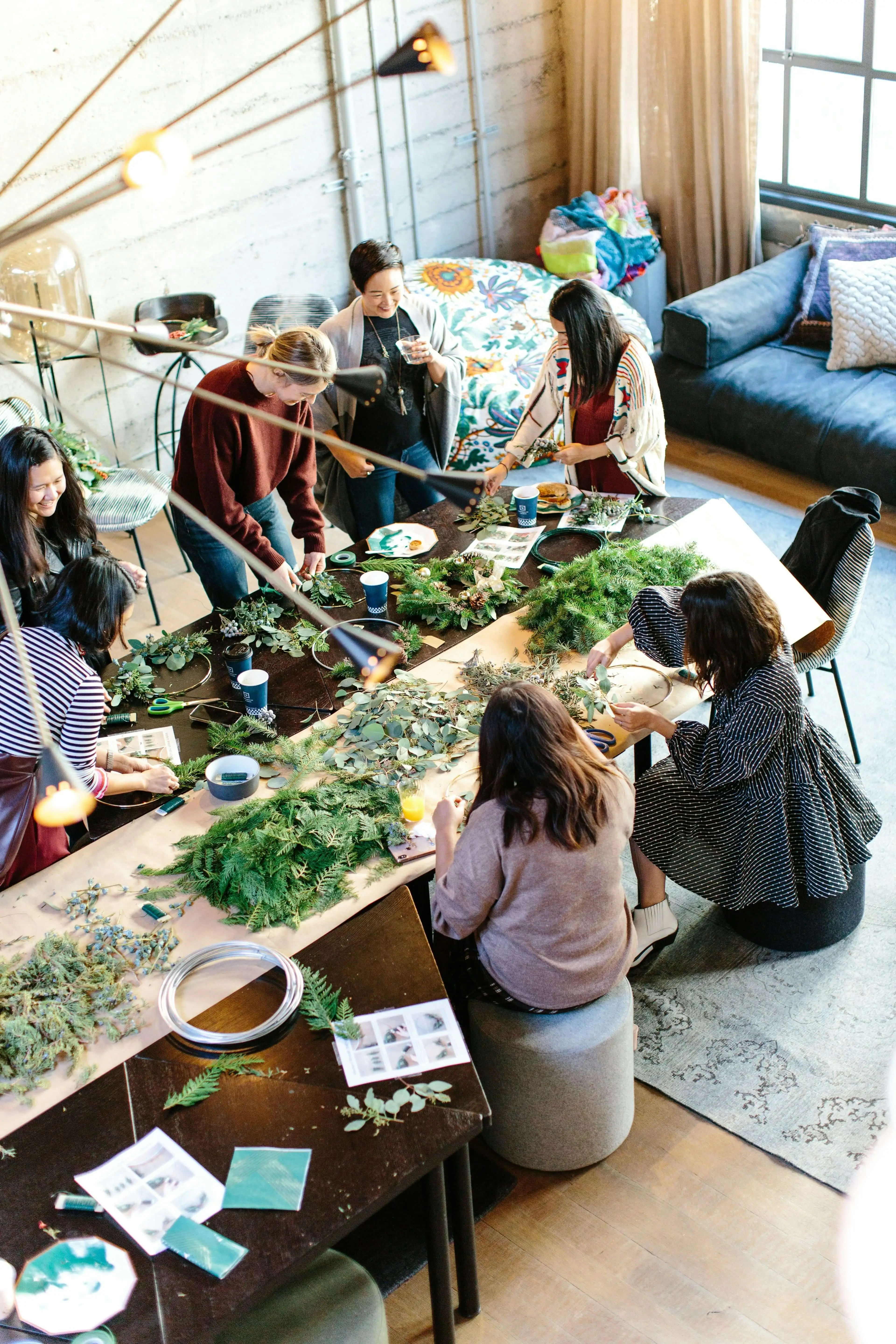 A group of friends doing arts and crafts together to signify how working with our hands can relieve anxiety.