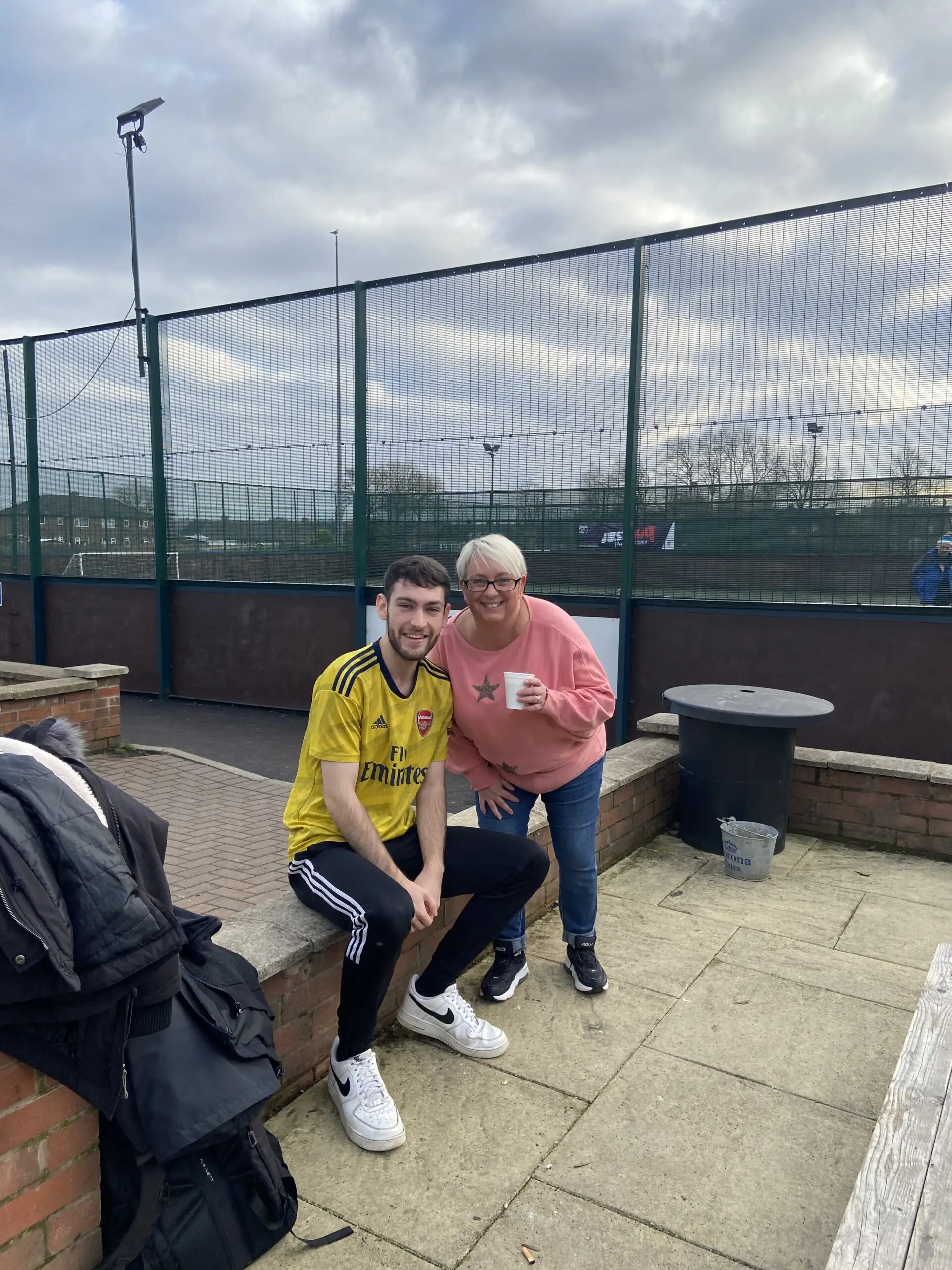 resident and staff member at the football game