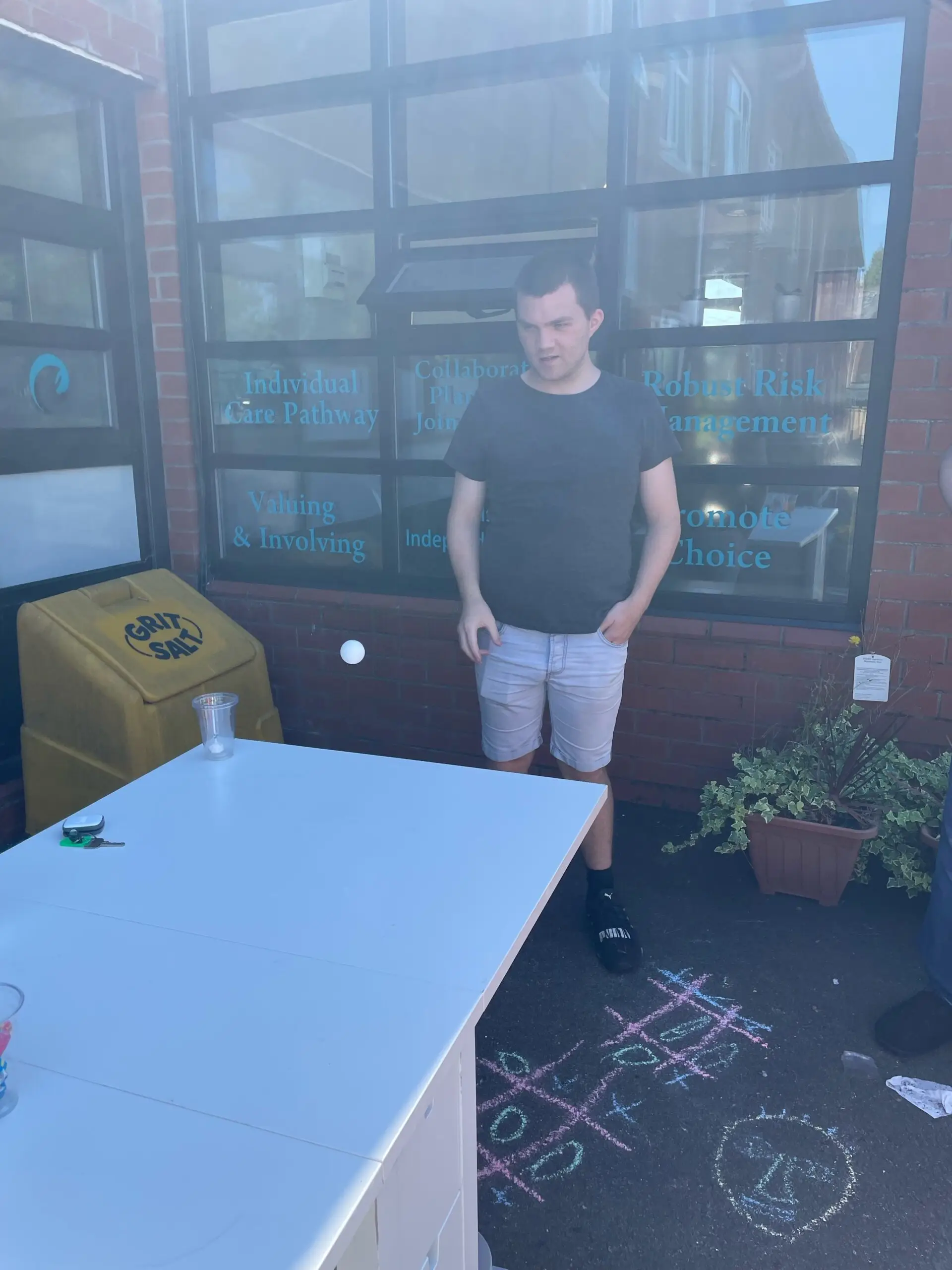 resident playing juice pong