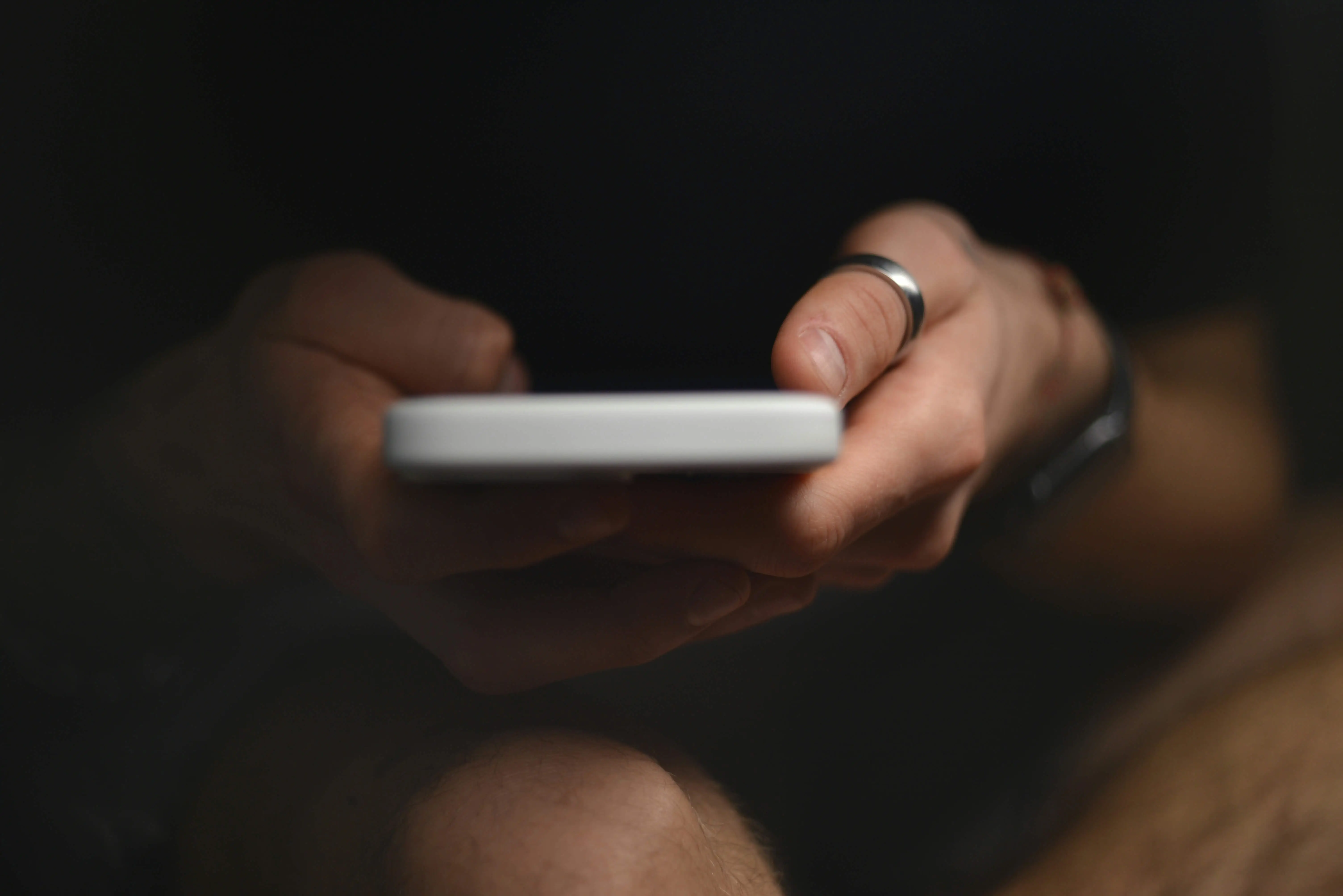 Phone being held in hand representing AI and it's addictiveness. For a blog on AI and why it might not have all the answers to our mental health.