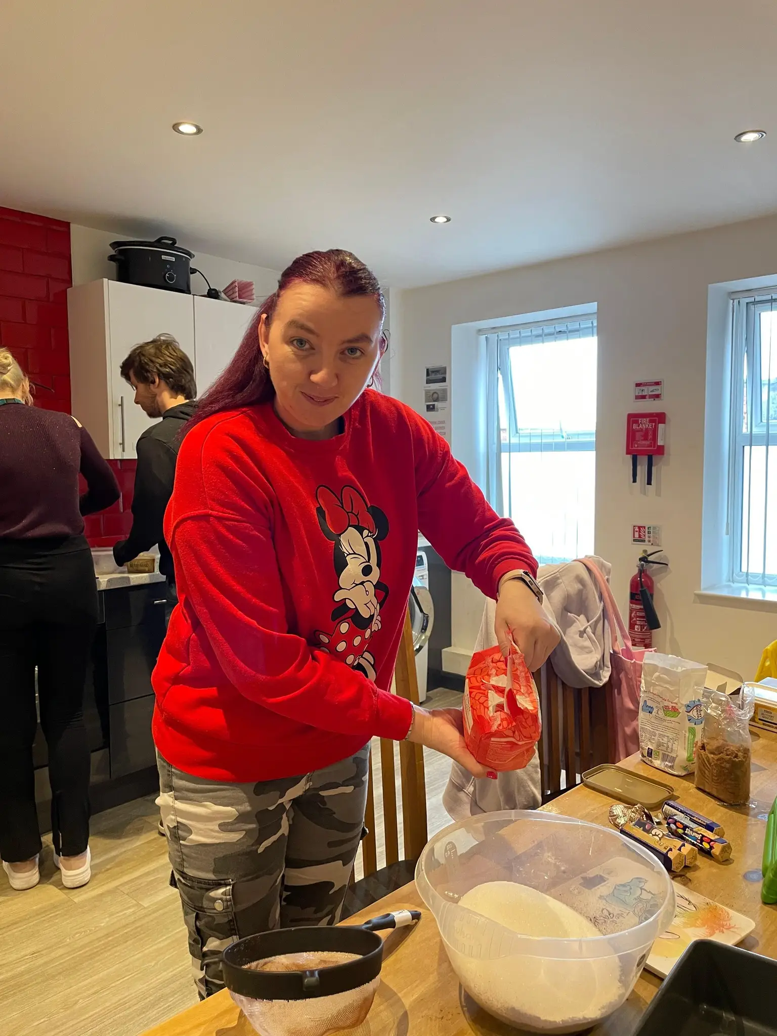 Female resident making brownies