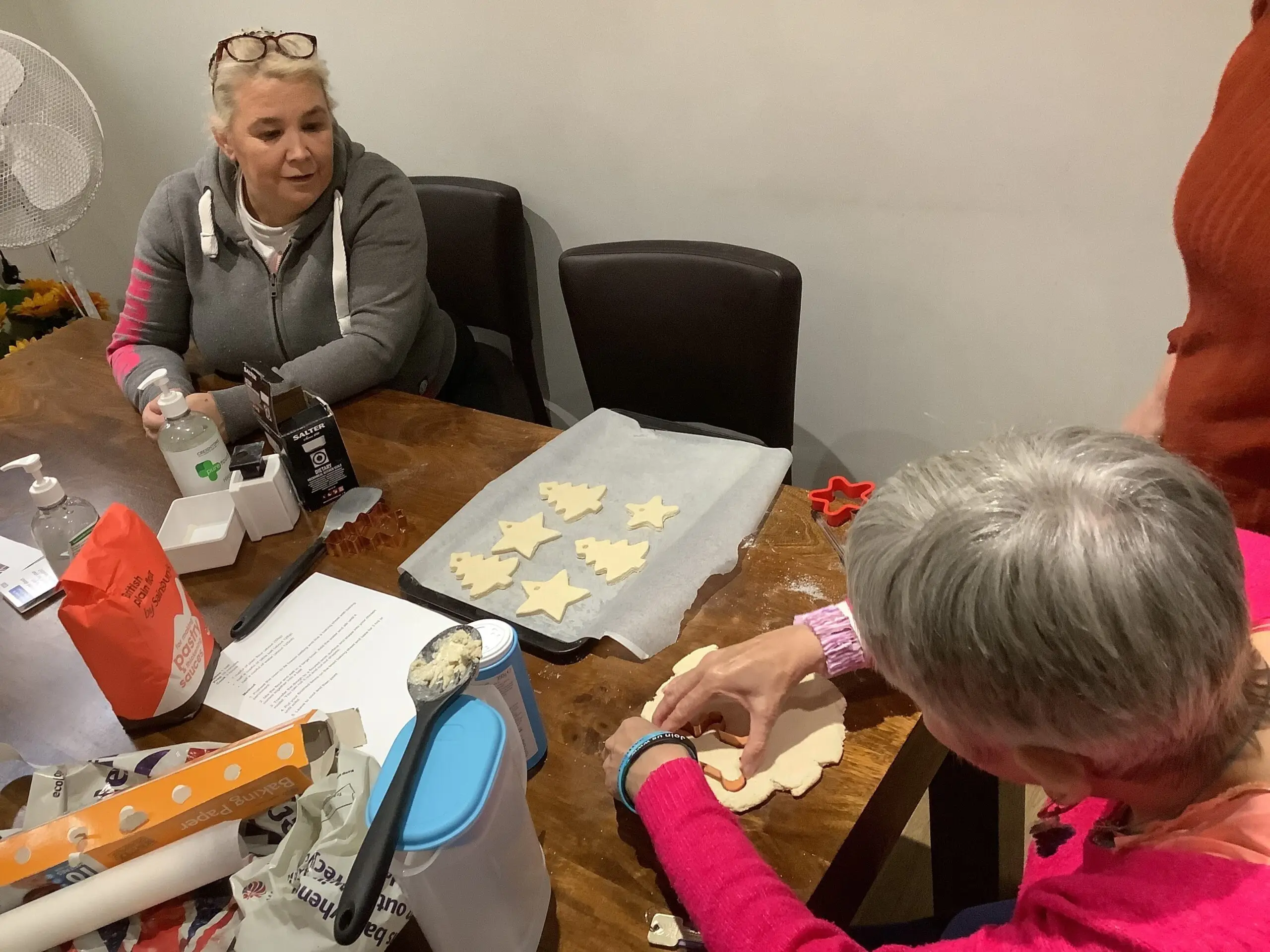 residents making christmas decorations