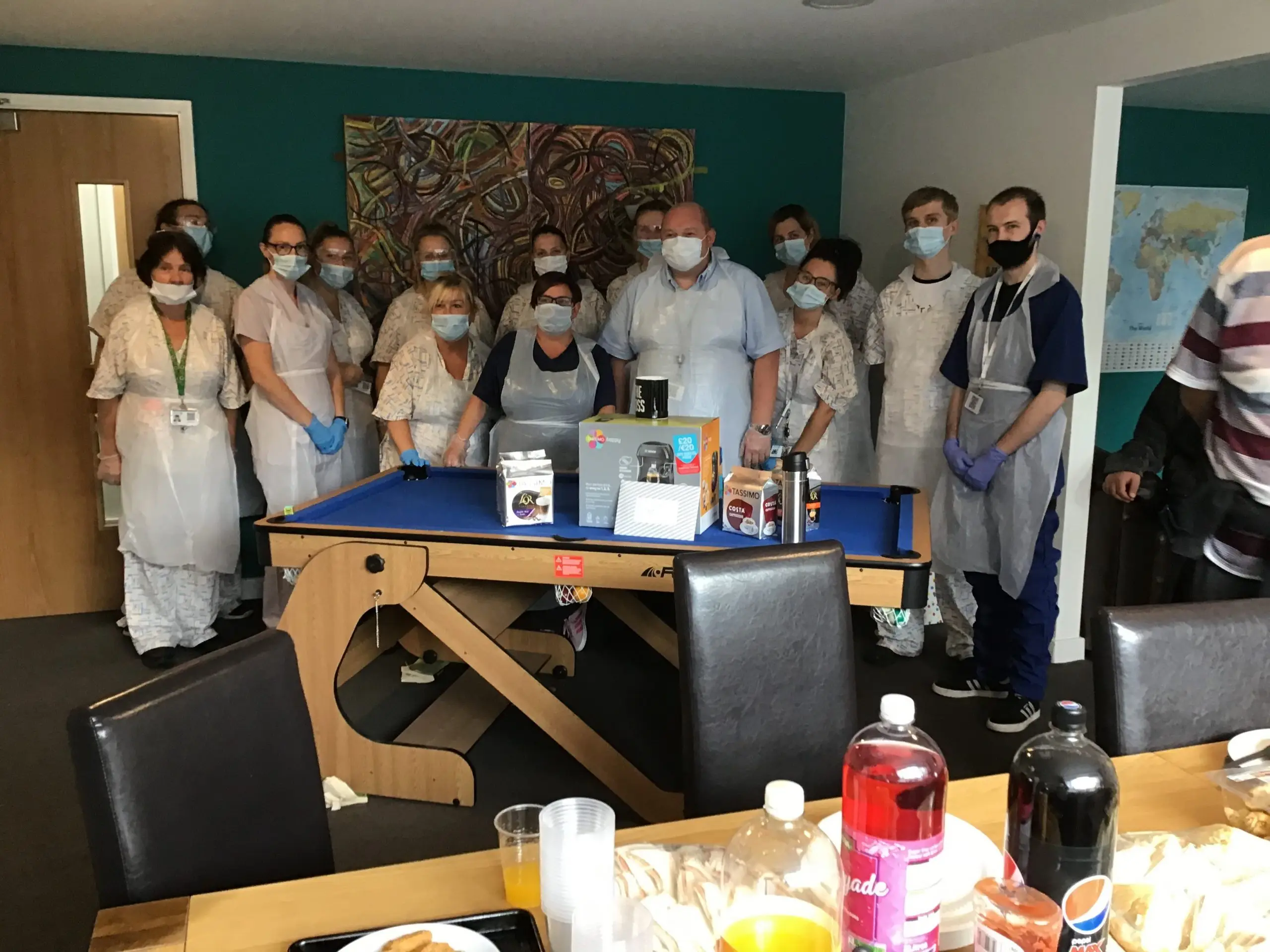 Team members dressed in PPE