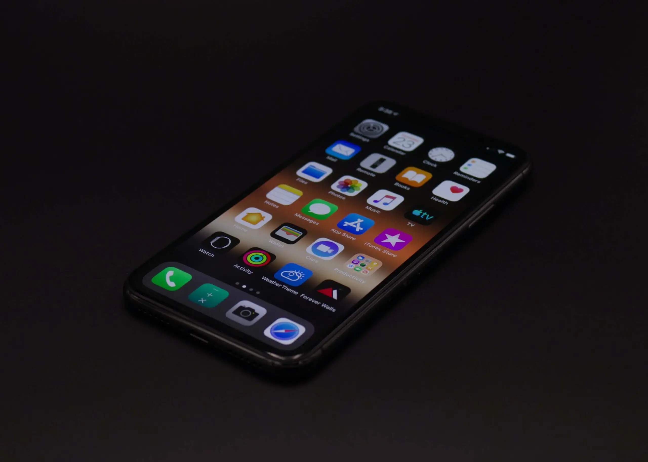 iPhone blue light glowing in darkness.