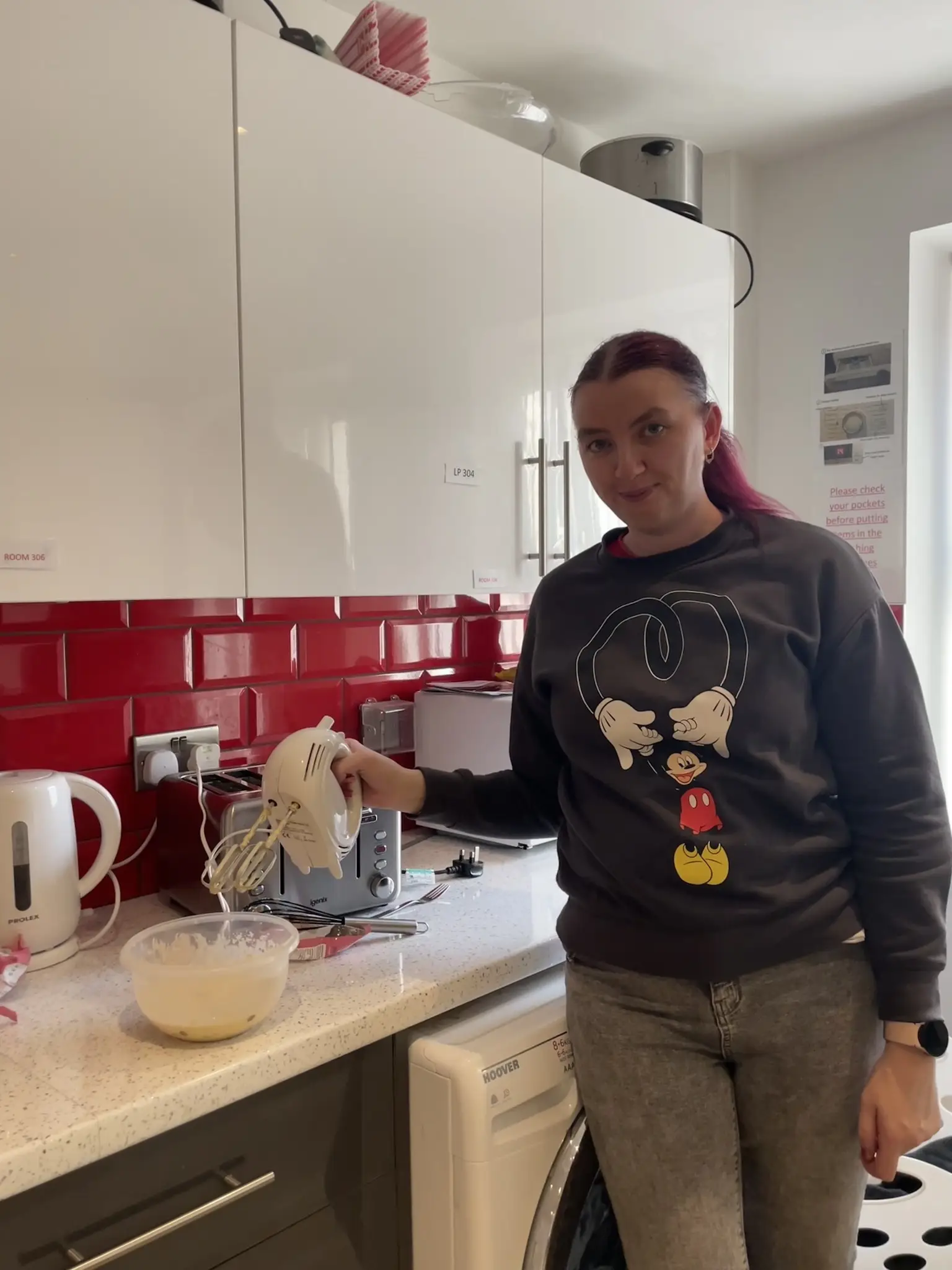 Female resident whisking pancake mix