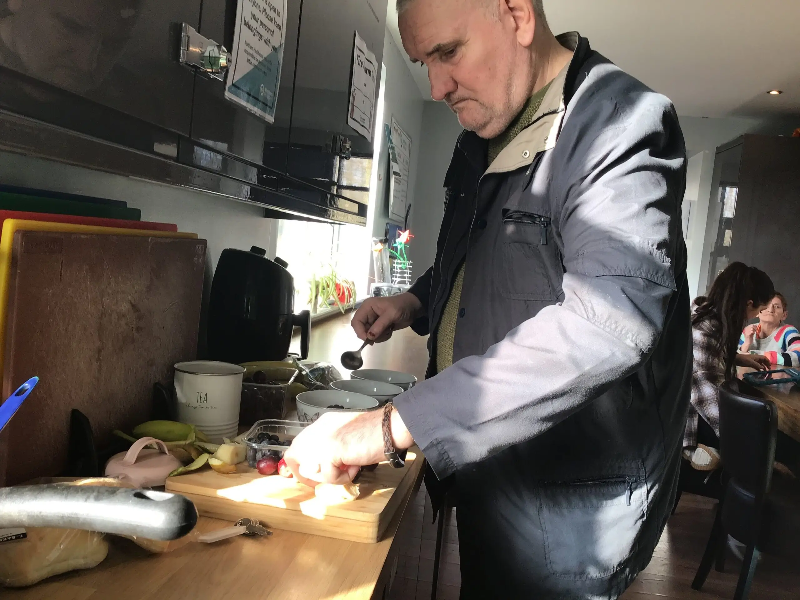 resident chopping fruit
