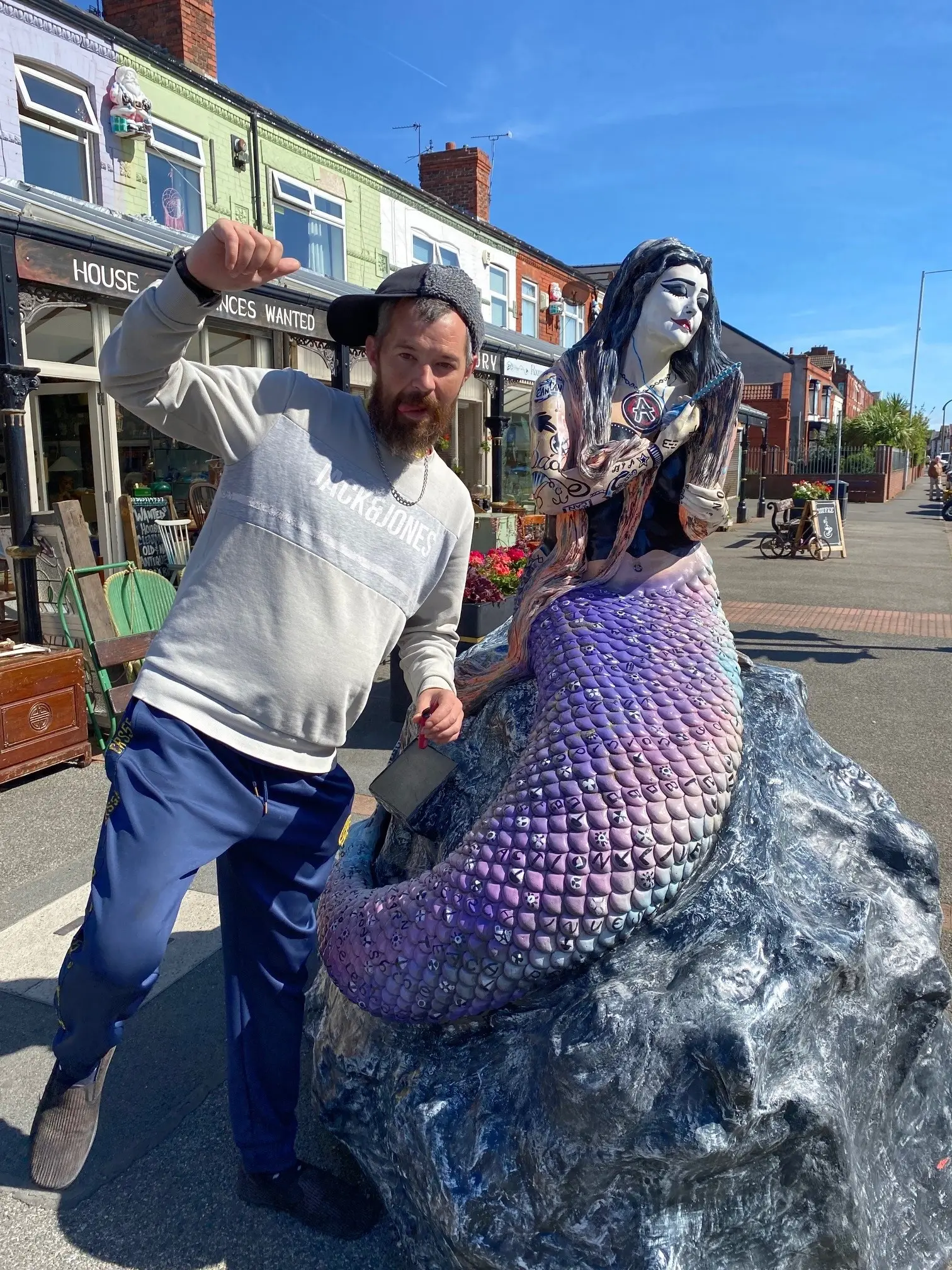 resident with mermaid statue