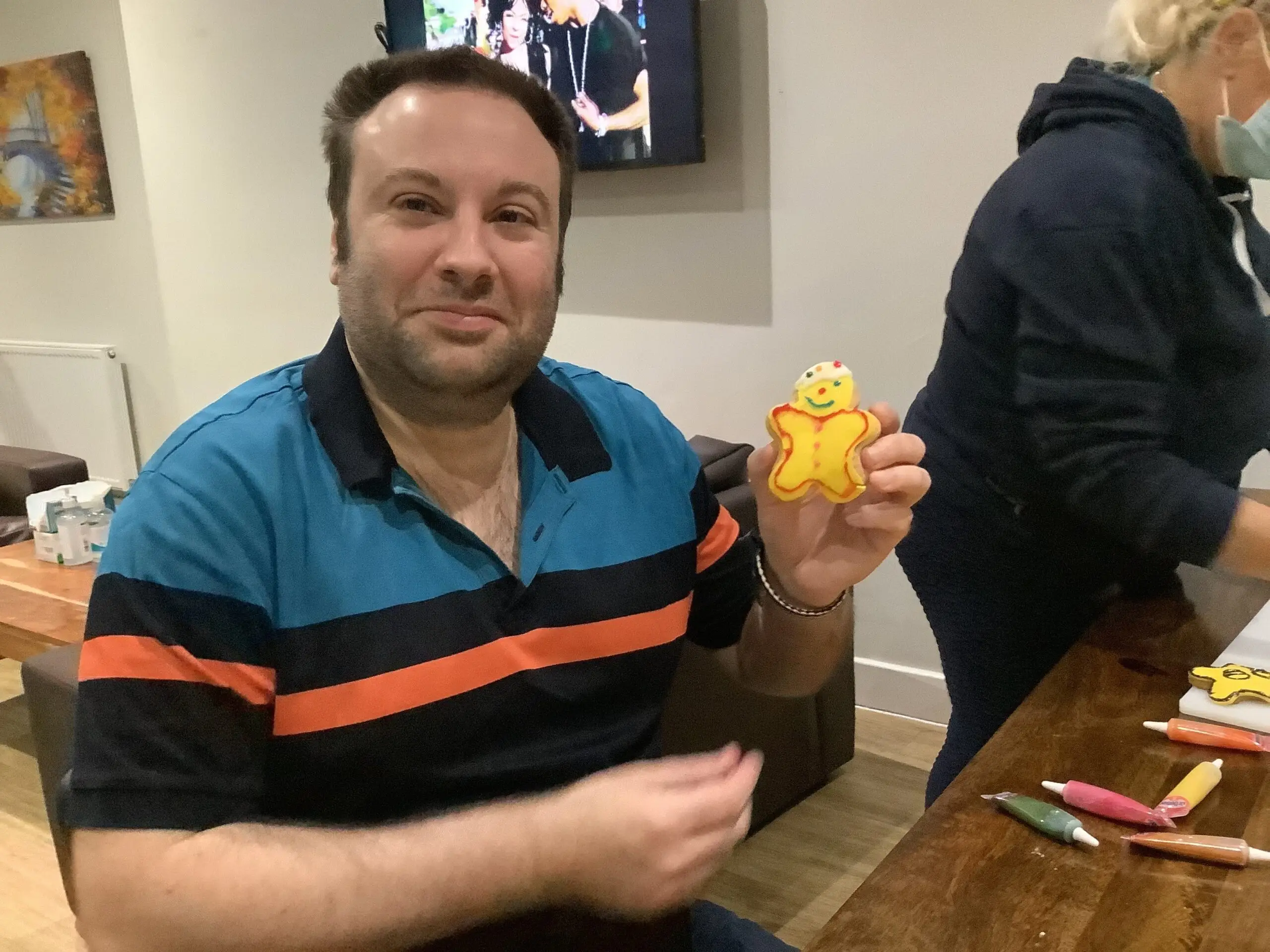 resident holding pudsey bear biscuit