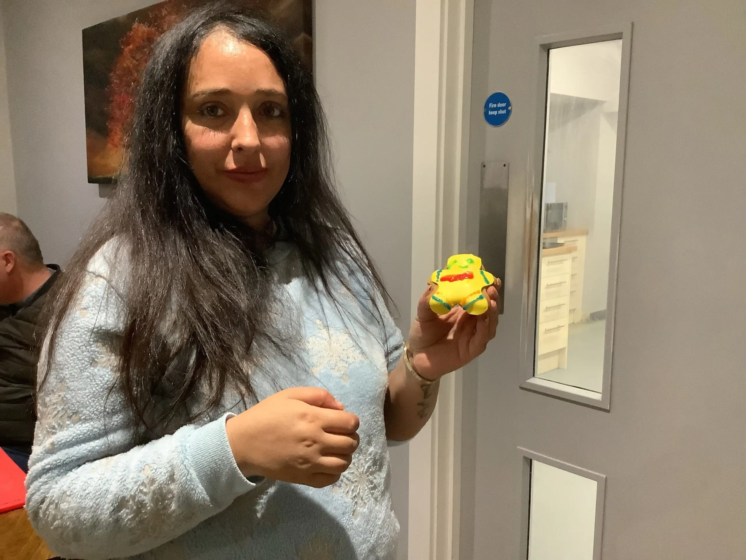 resident holding pudsey bear biscuit