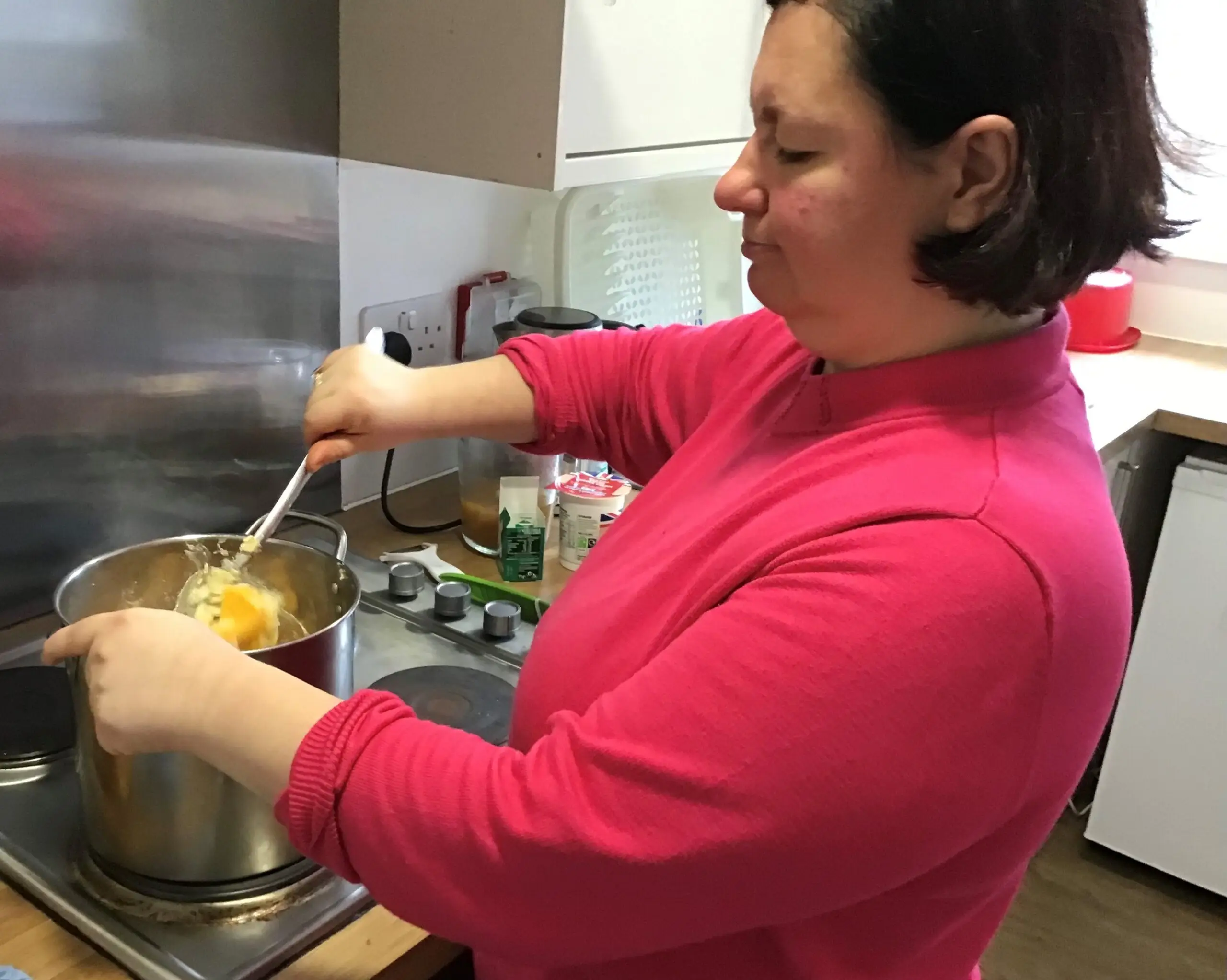 resident cooking pumpkin soup