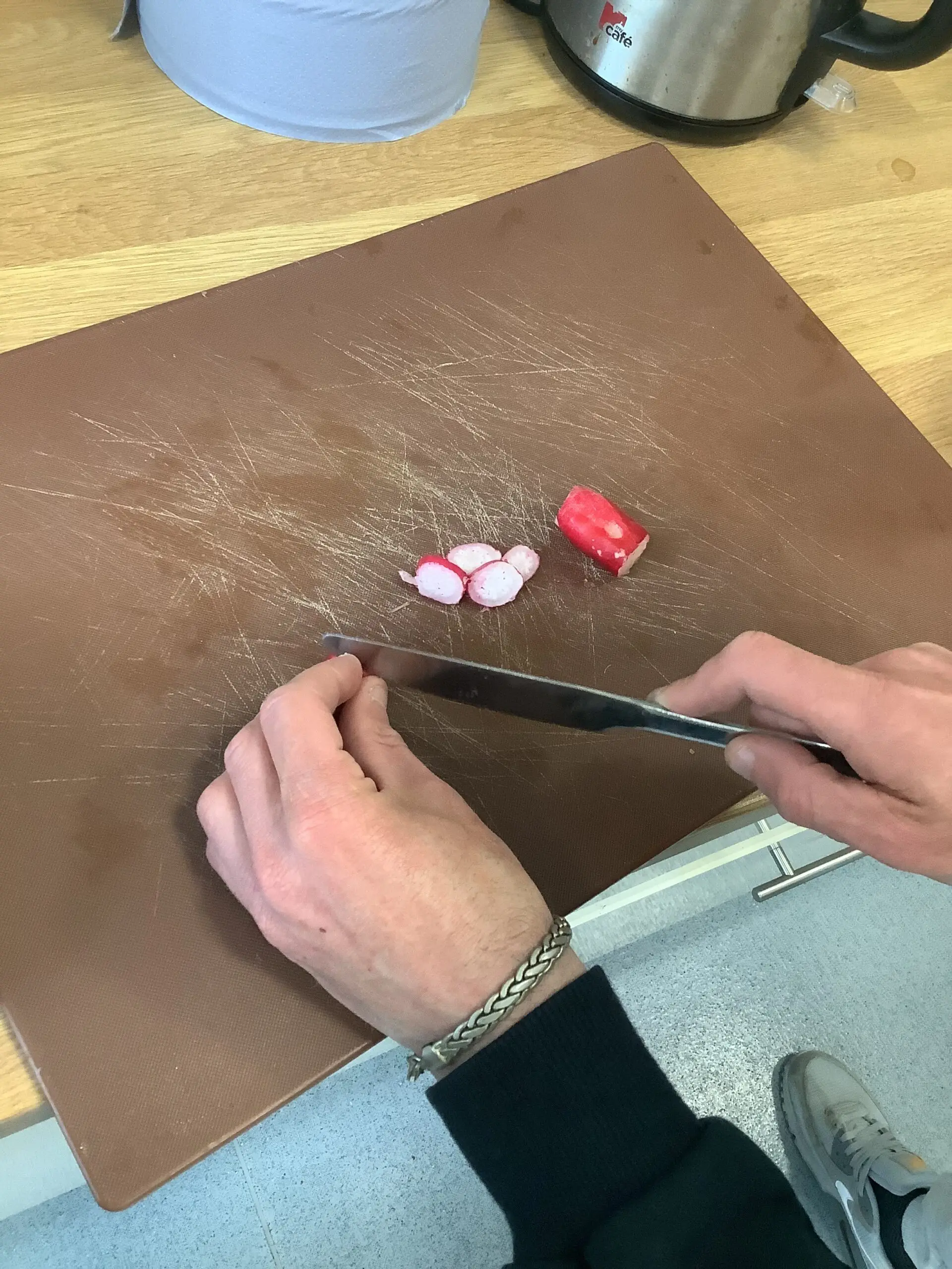 chopping radish with knife