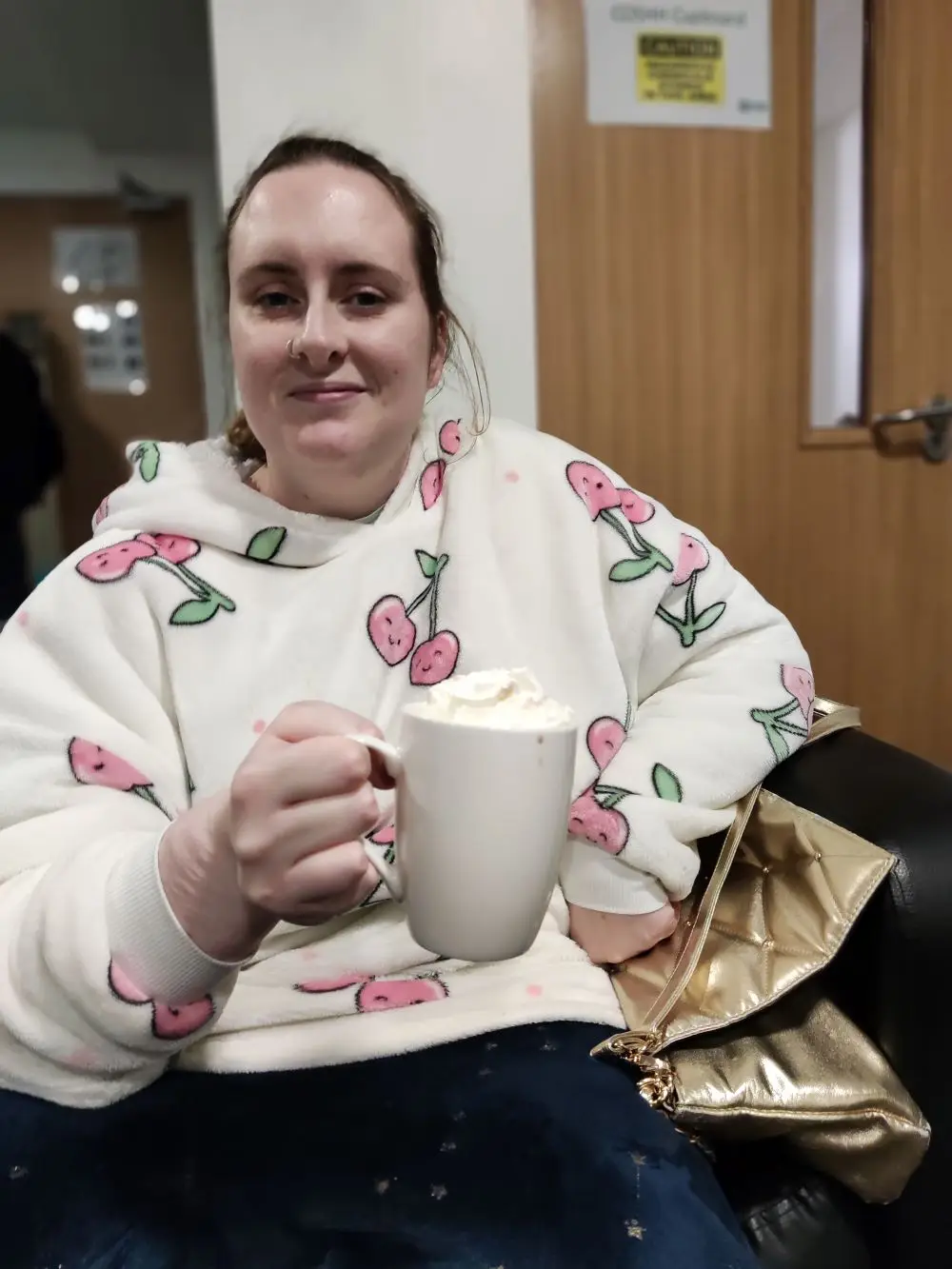 Female resident holding hot chocolate