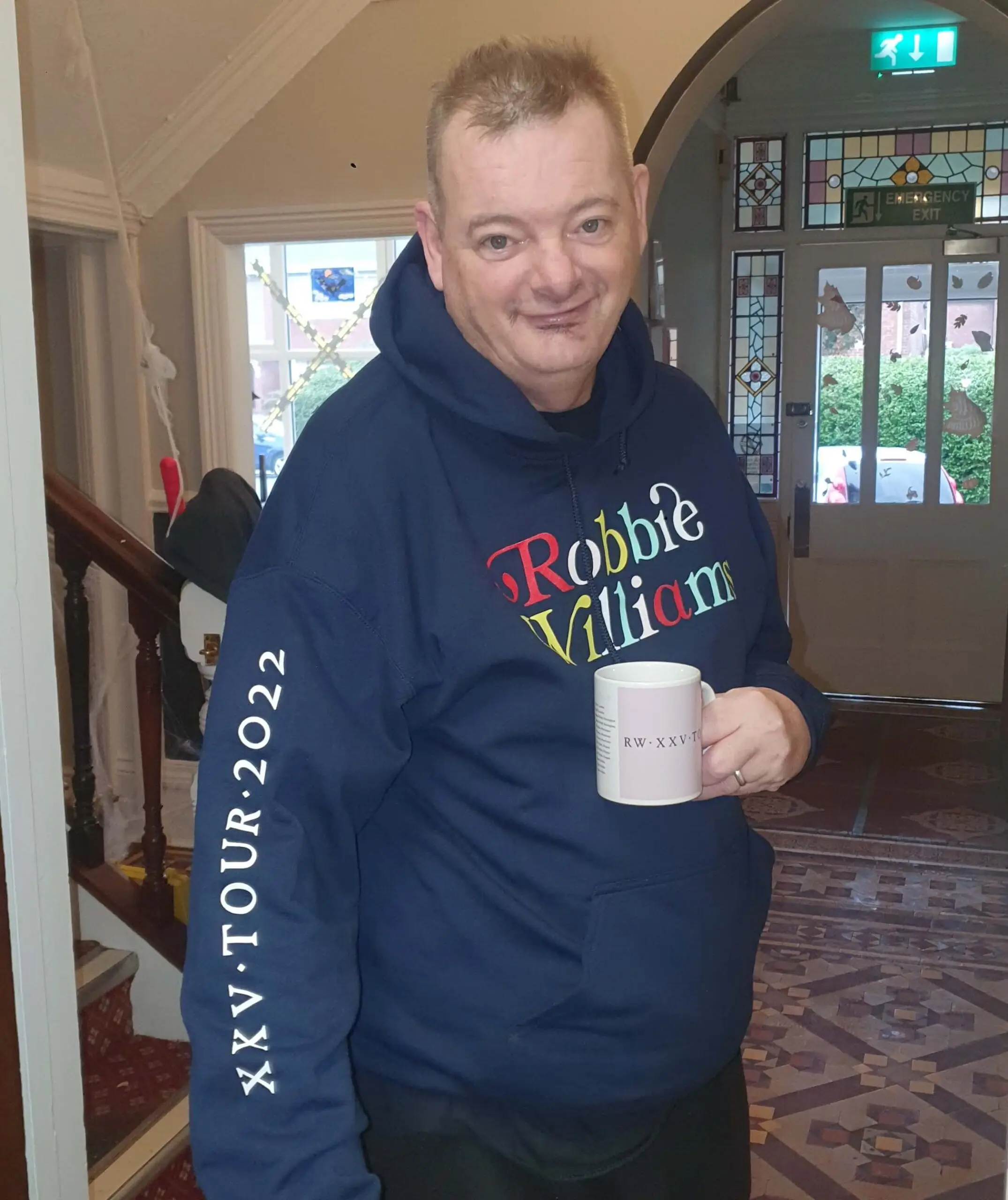Resident wearing Robbie Williams merchandise