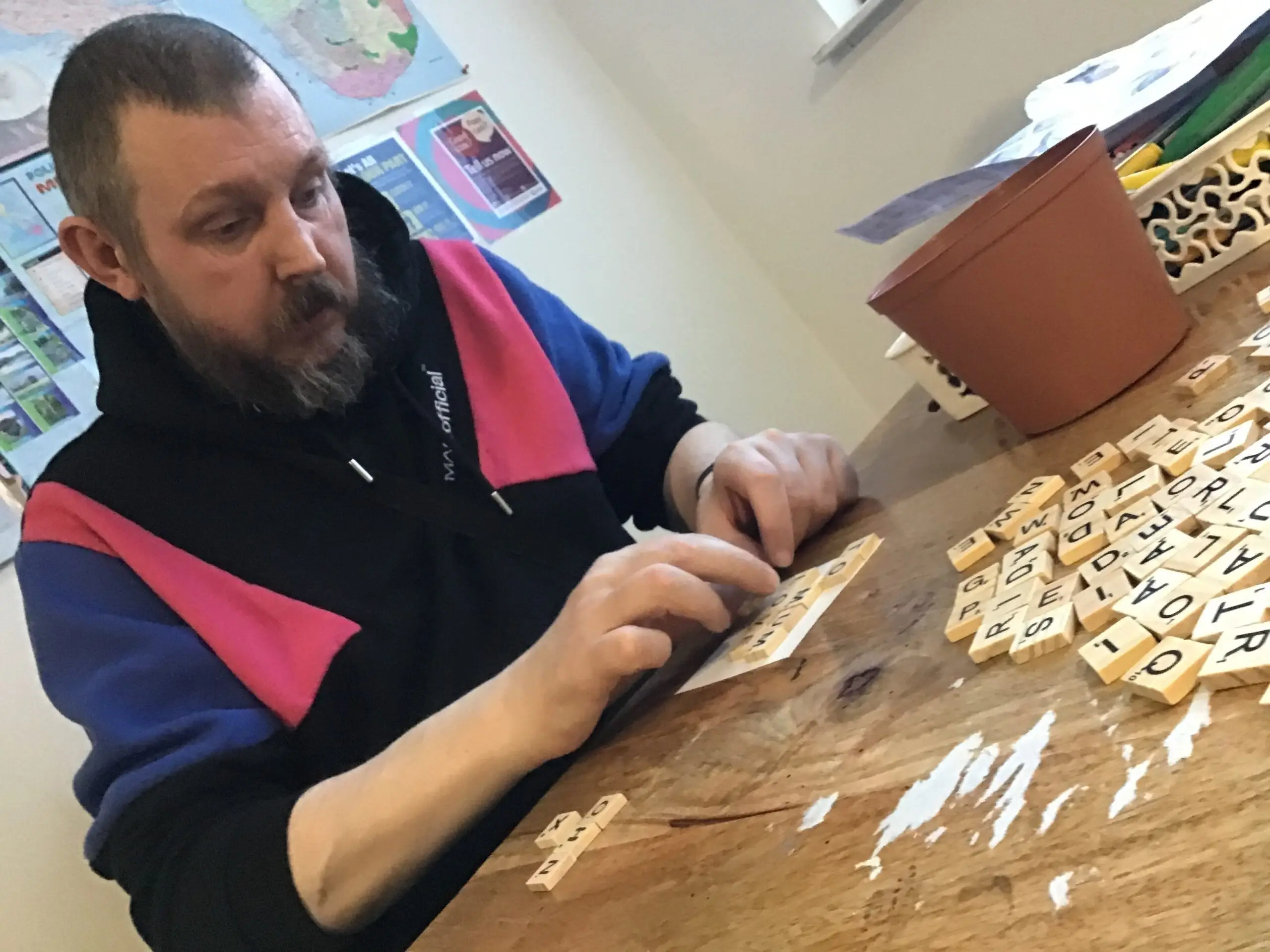 resident making Scrabble picture frame