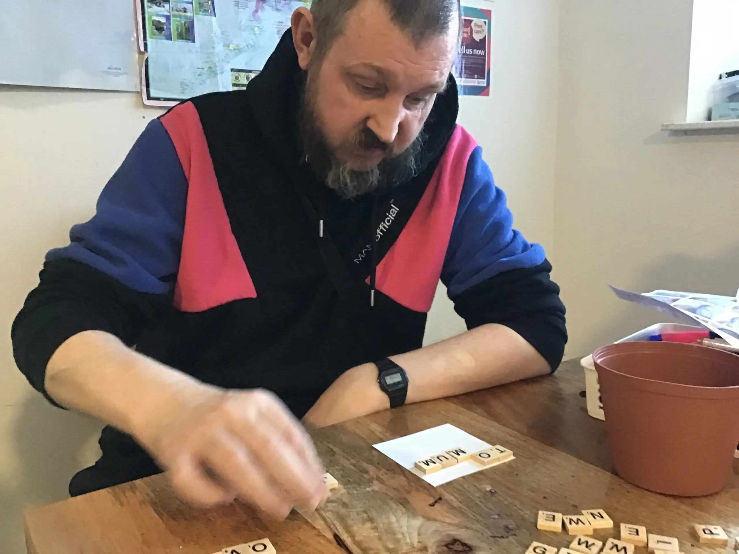 resident making Scrabble picture frame