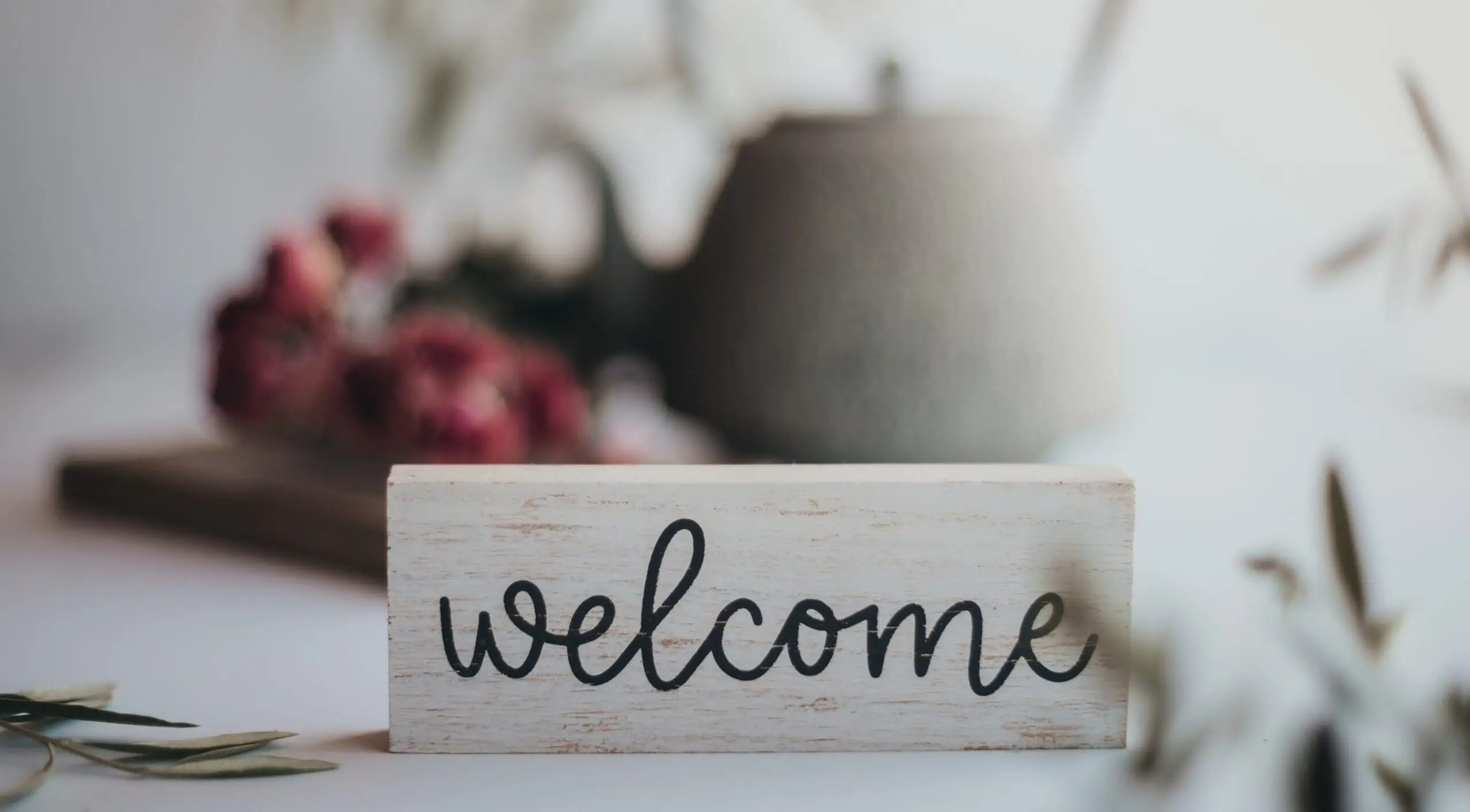 new clinical development director - welcome sign infront of white teapot