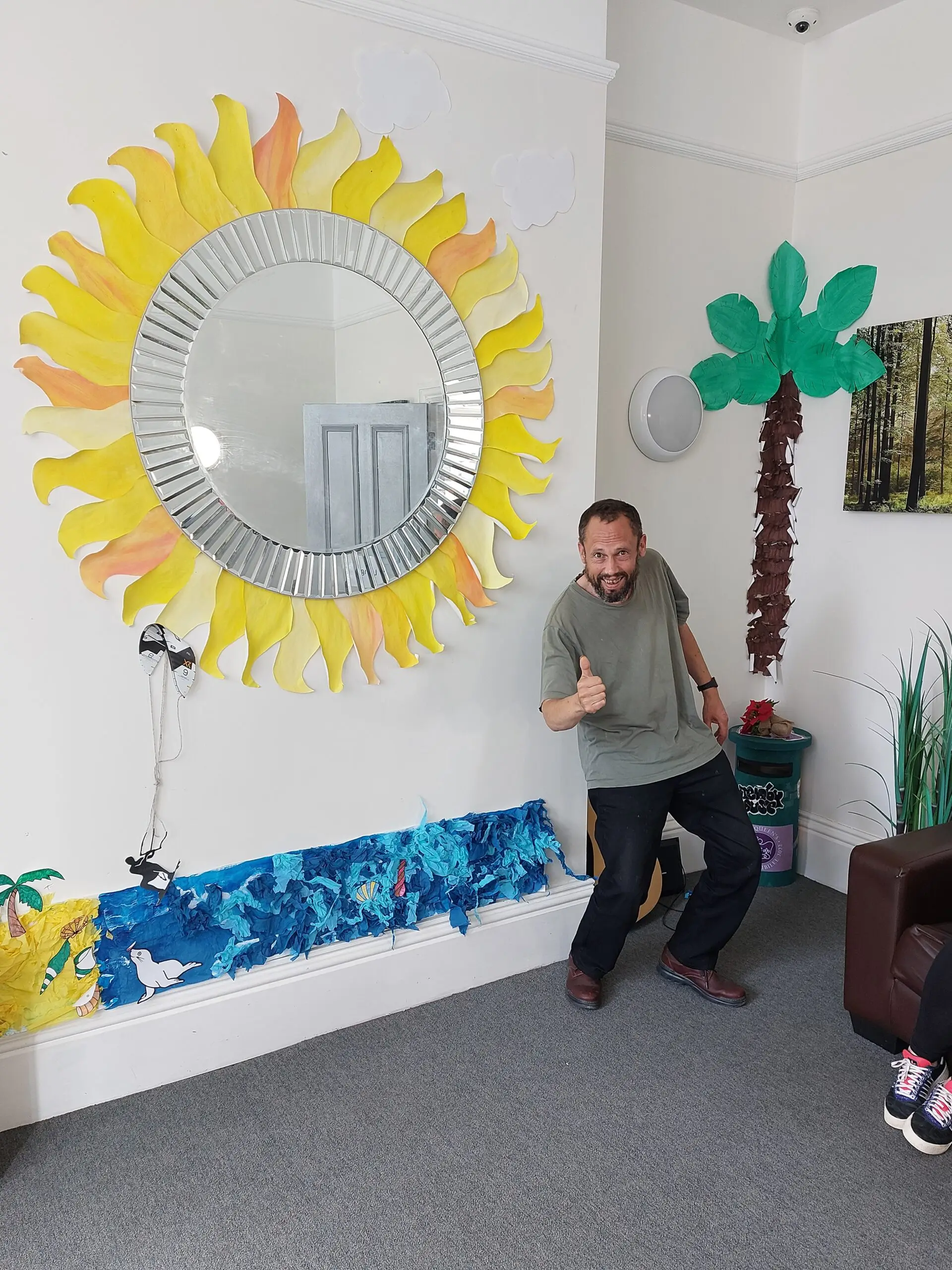 resident in front of Summer wall display