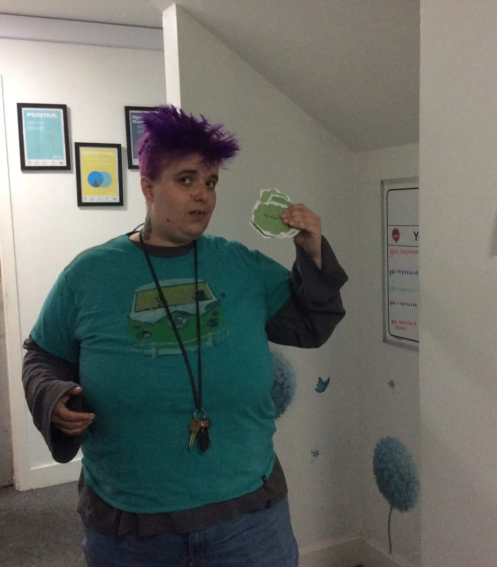 resident in green tshirt holding treasure hunt clue