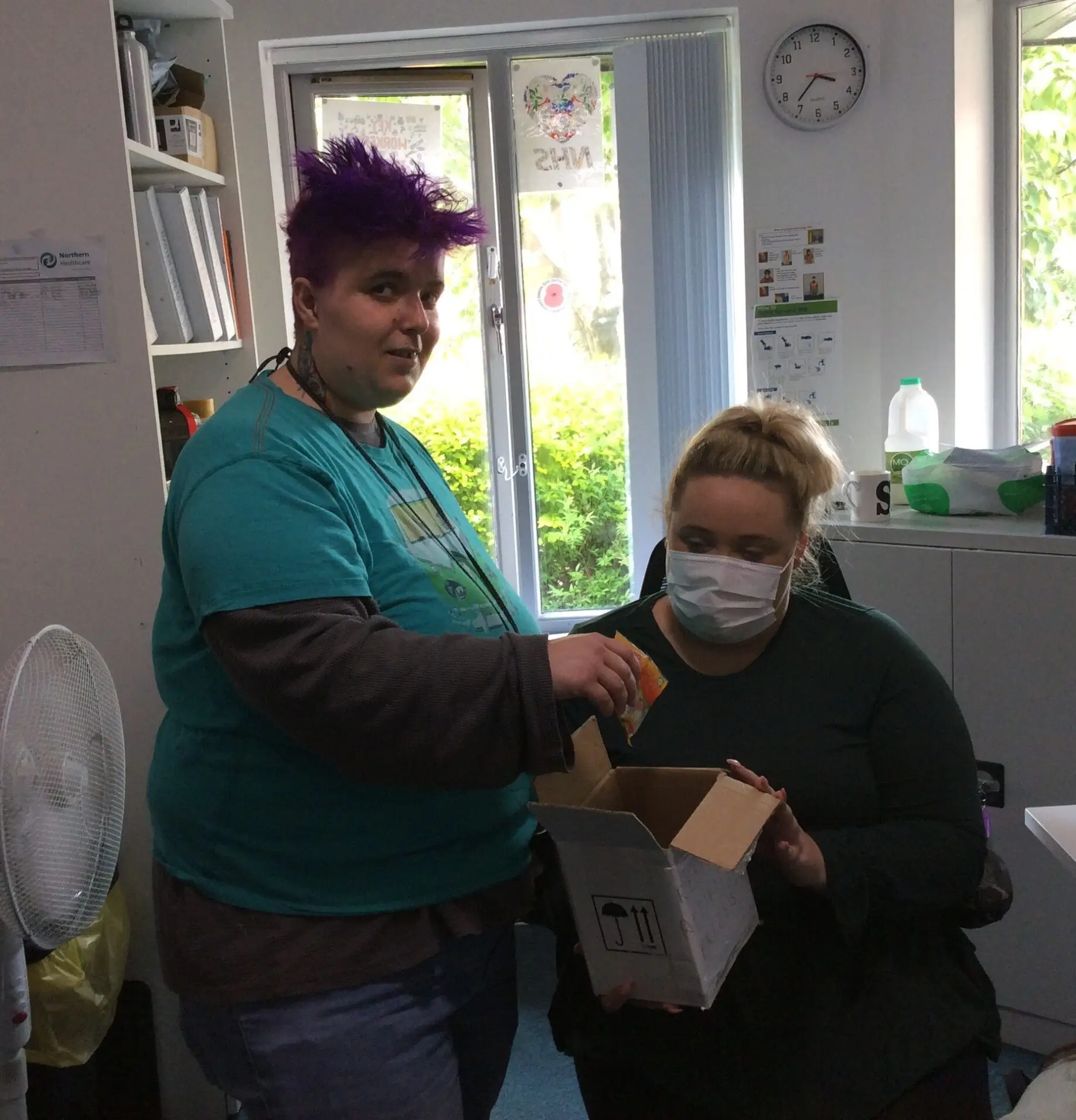 resident and service manager receiving the prize for treasure hunt