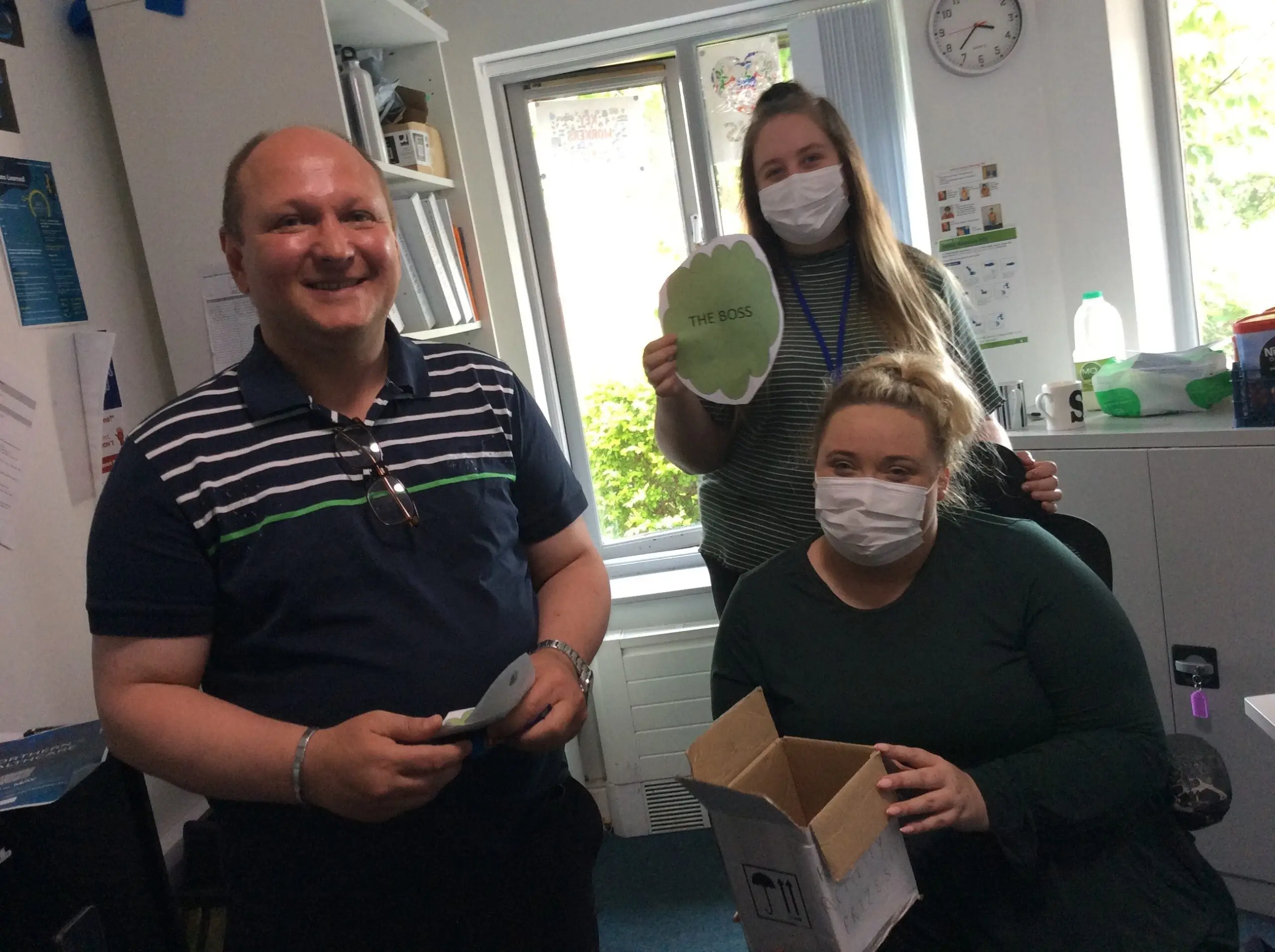 resident and service manager receiving the prize for treasure hunt