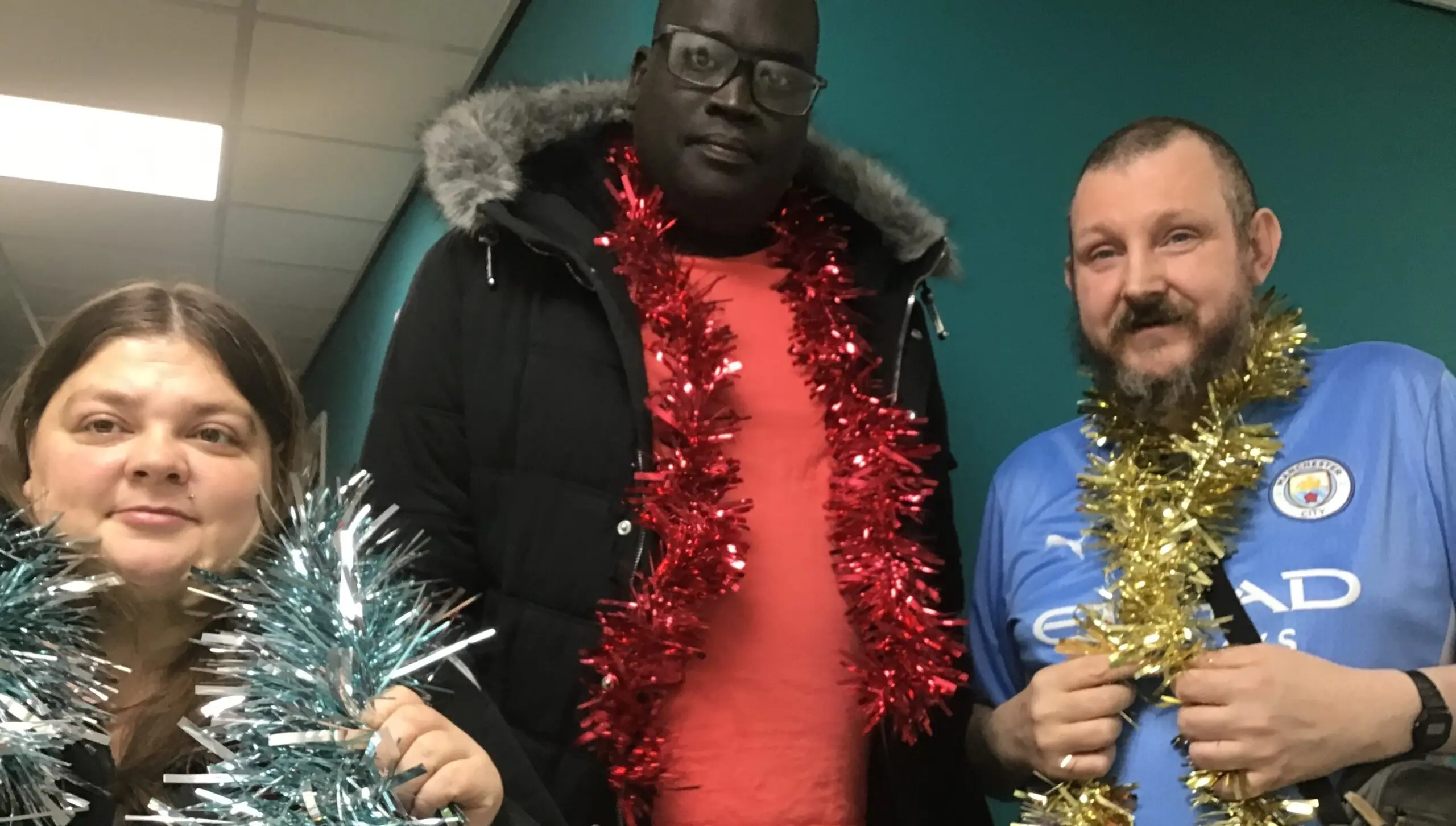 residents with tinsel scarves