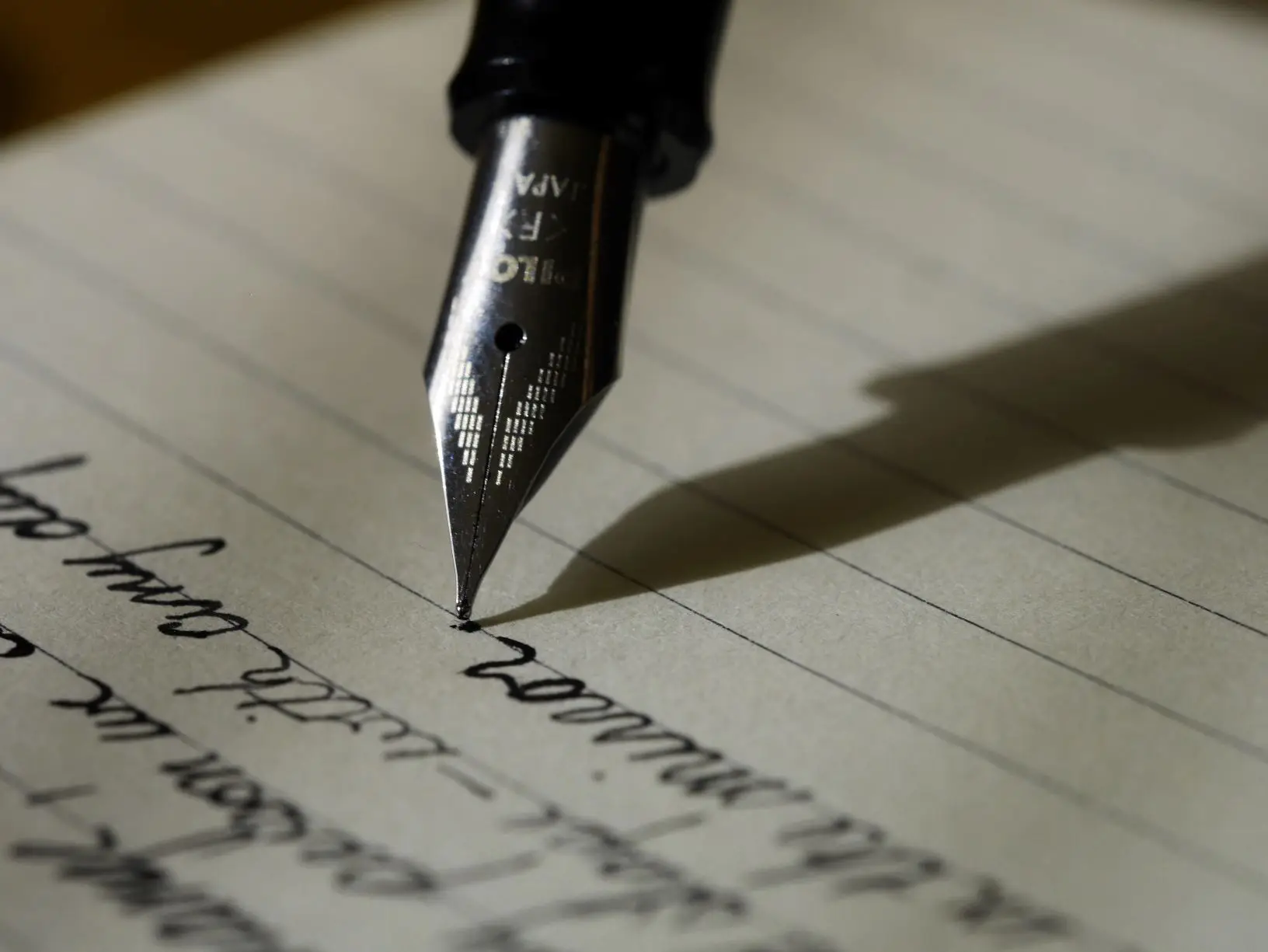 pen writing on lined paper