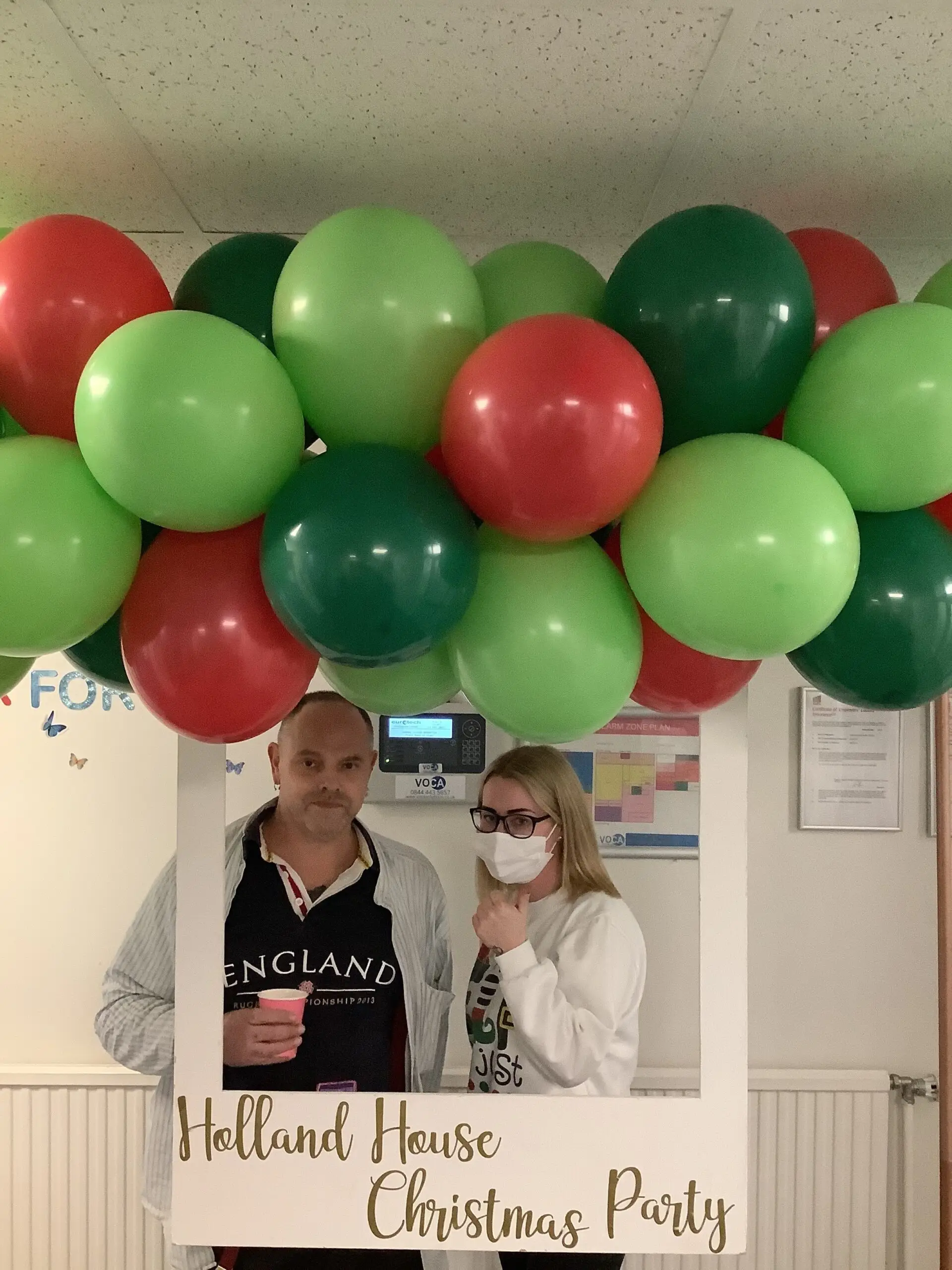 residents posing at christmas photo station