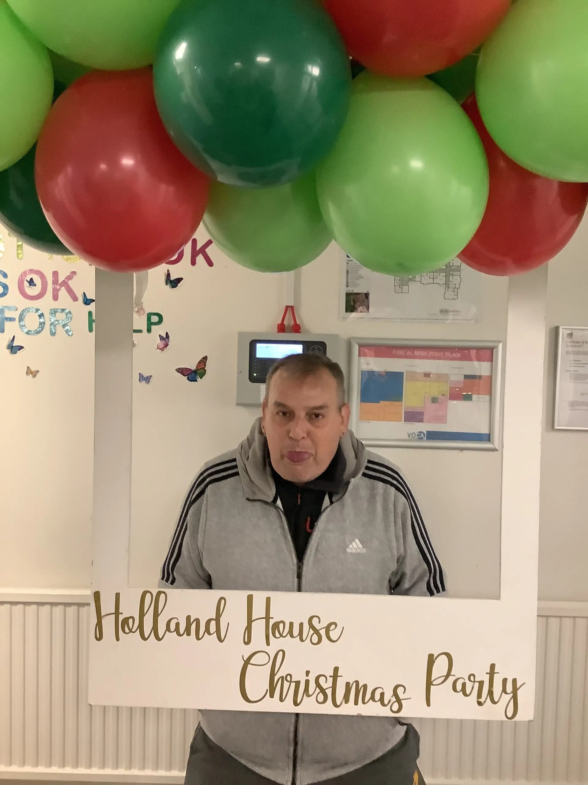 residents posing at christmas photo station