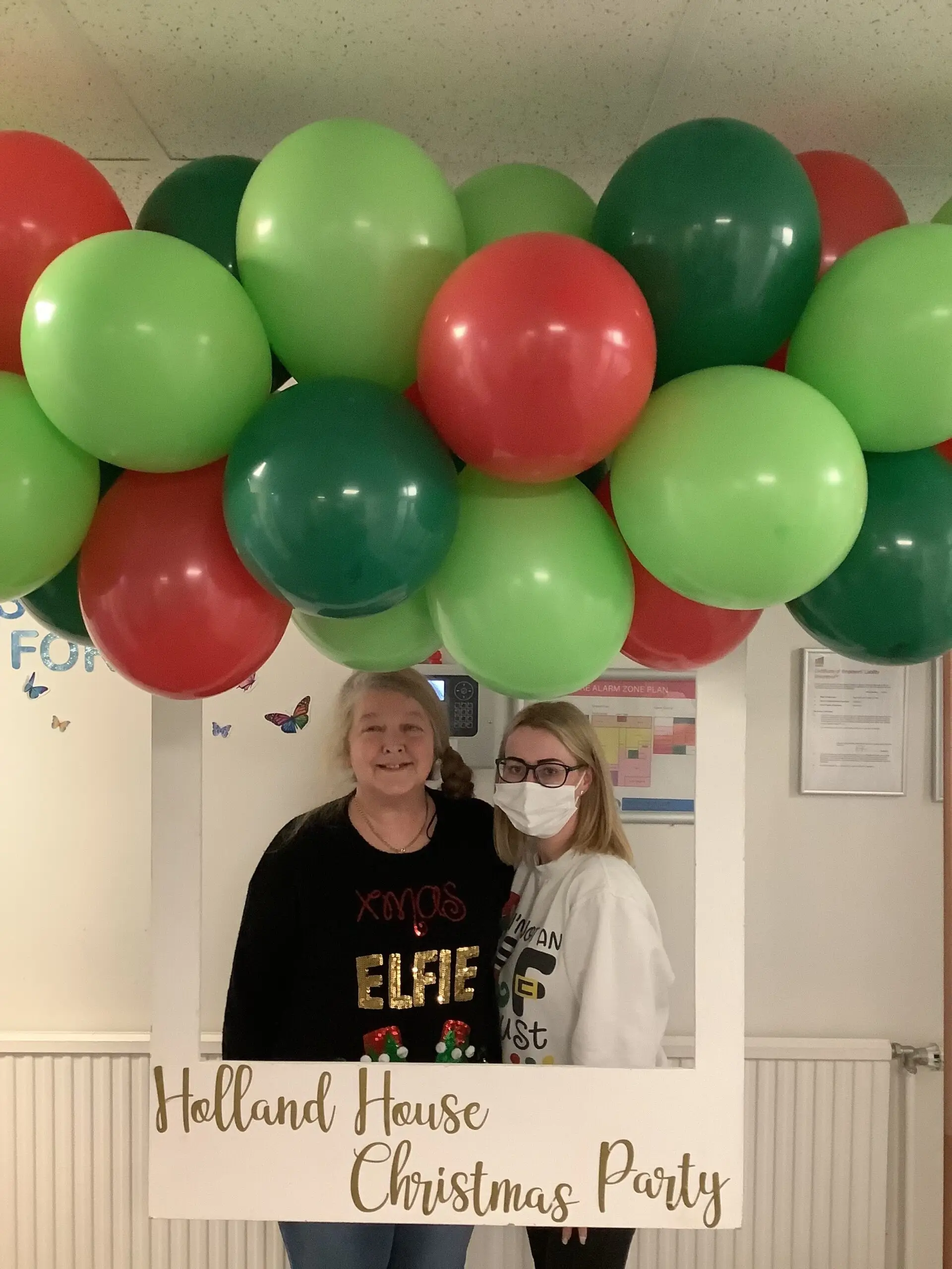 residents posing at christmas photo station
