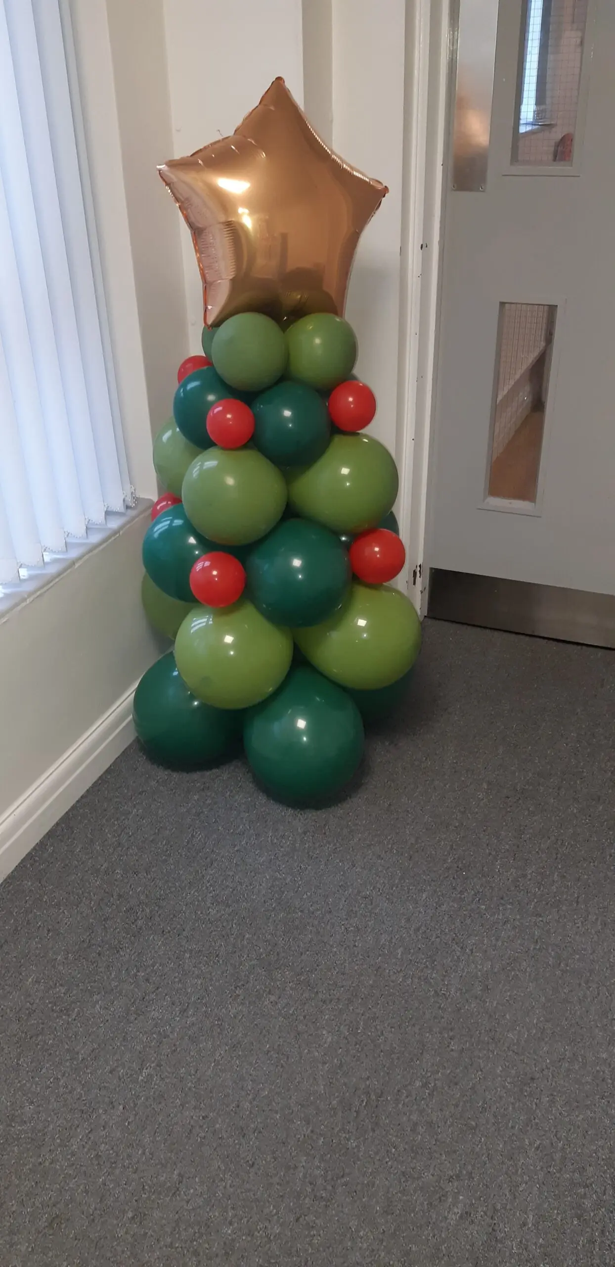 christmas tree made from green balloons